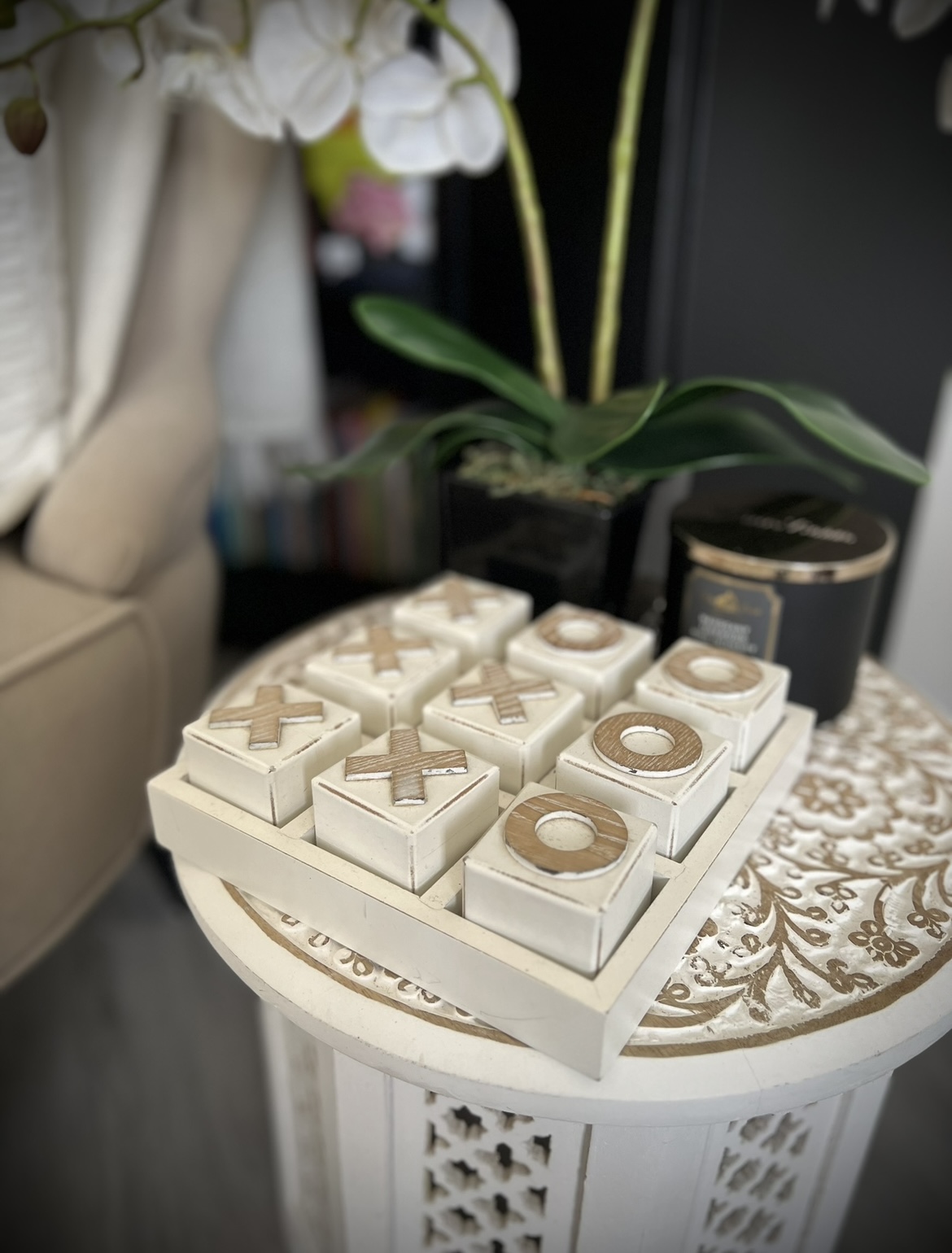 The heart of the home, where conversations flow and memories made. - White candle holders with wooden crosses, intricately
