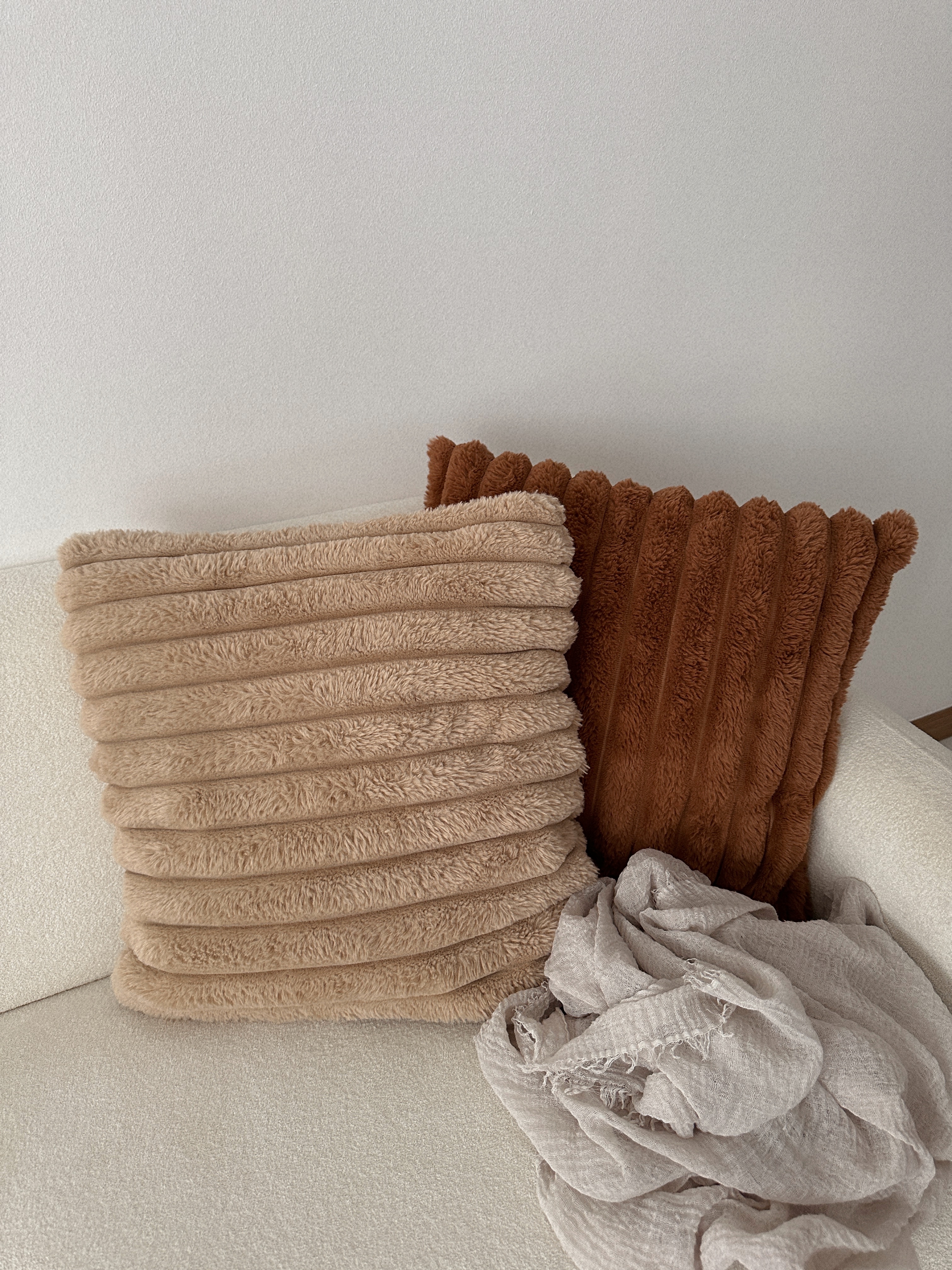 Our Cosy Minimalist Living Room: Where Endless Possibilities Unfold - Soft, fluffy beige and brown throw pillows