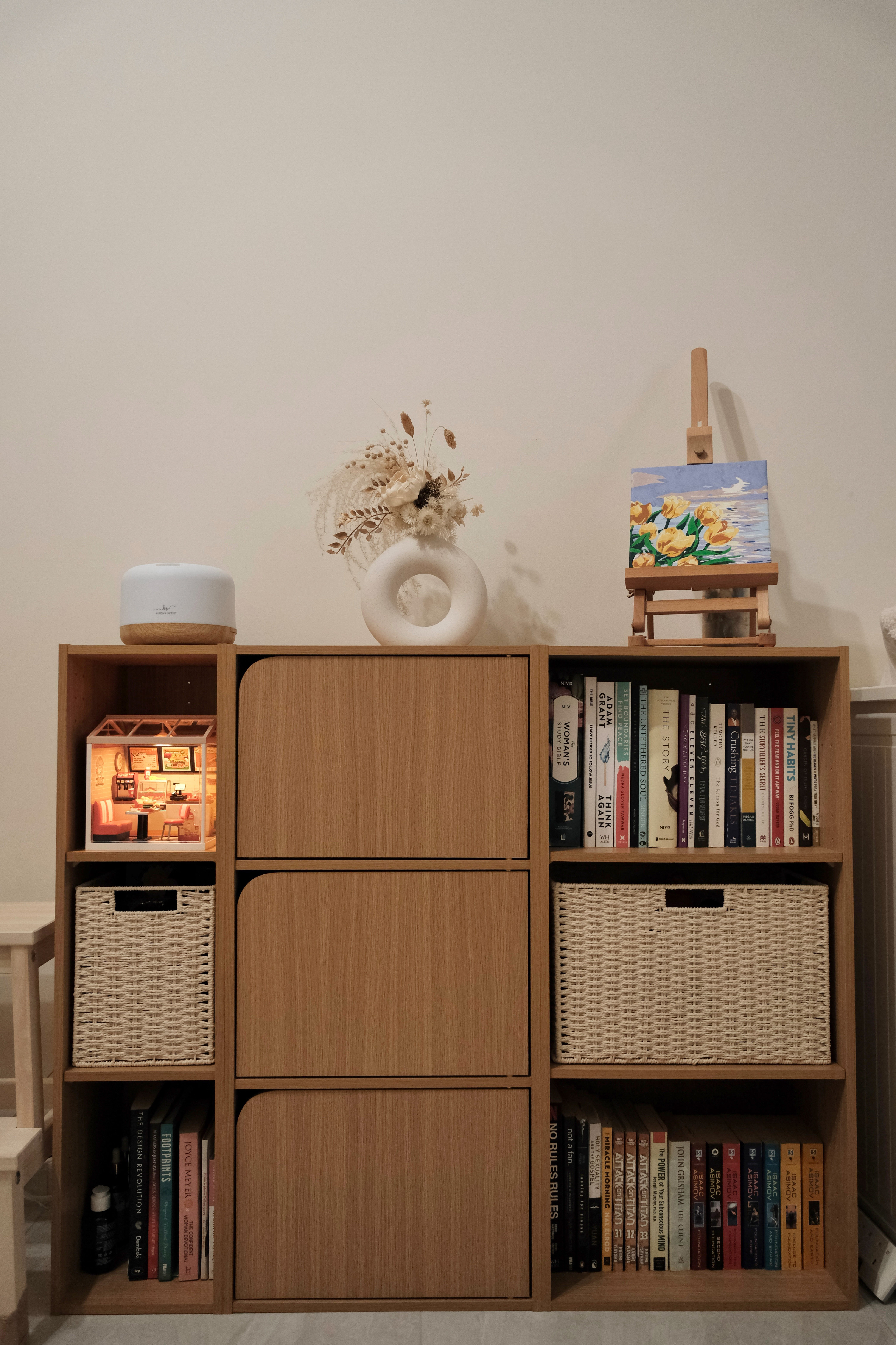 Inviting you to step into our favorite haven in the house! ✨ - Wooden bookshelf, books, decorative items, small table, small