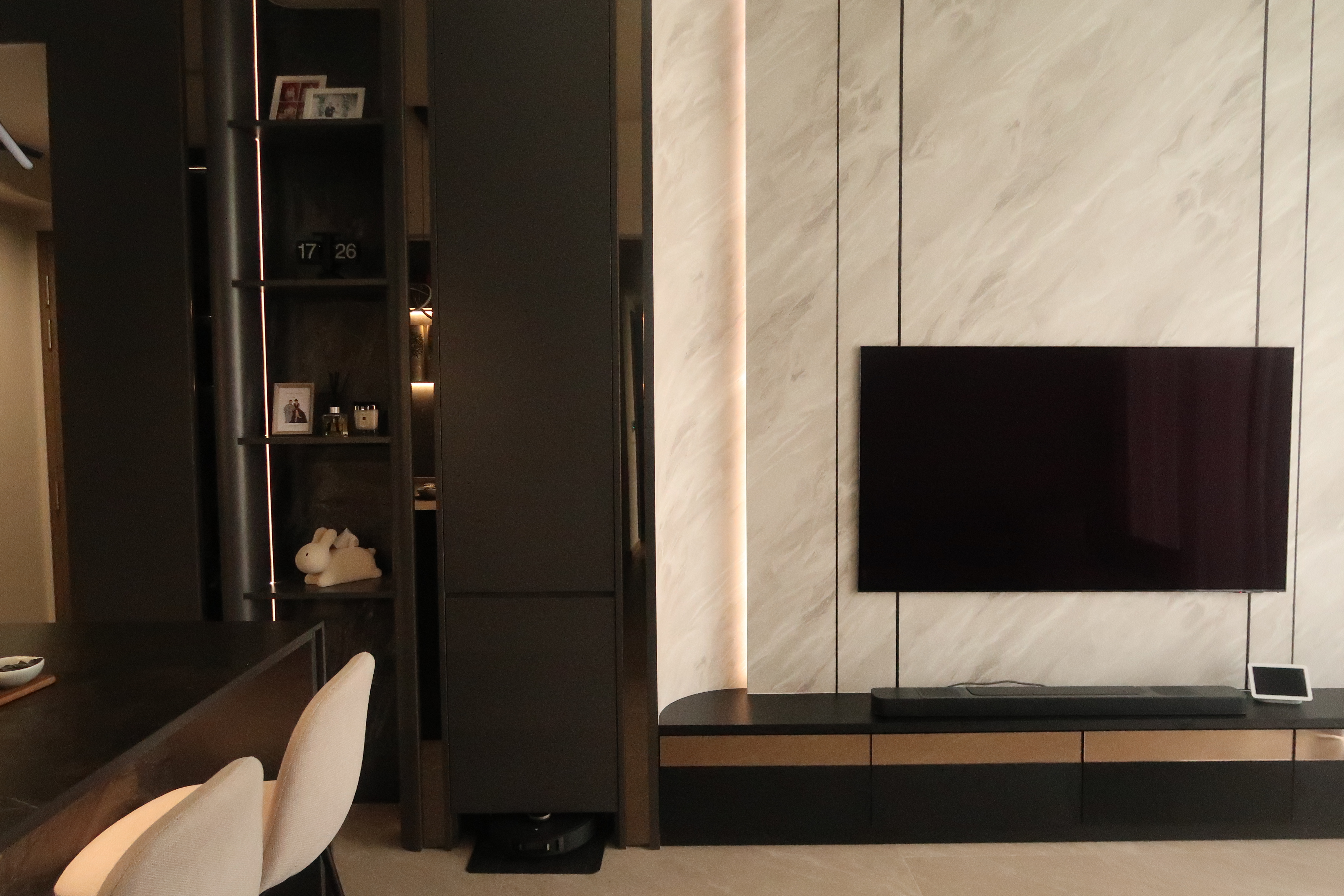 Simple and Sleek High Ceiling Living Room: Modern Dark Loft at North - Modern minimalist living room, sleek black furniture