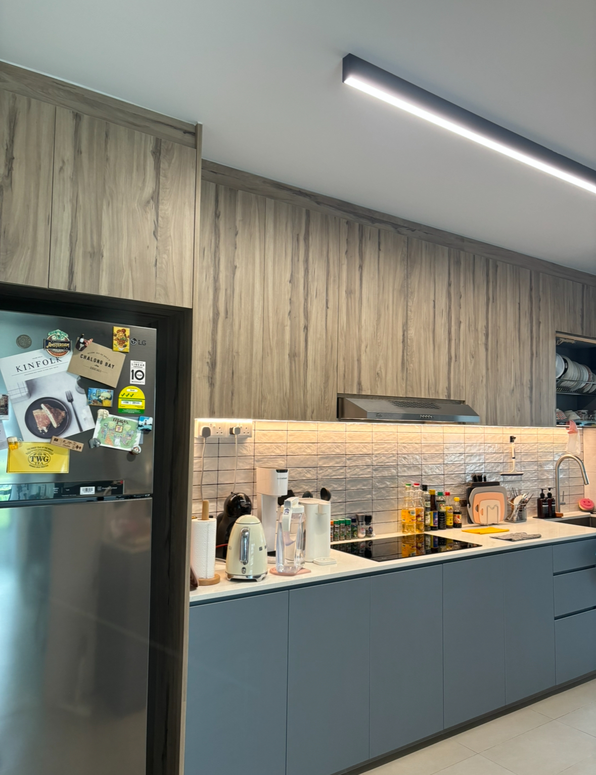 Before and After: All about the Details! - Wooden panel wall, stainless steel refrigerator, tiled backsplash, modern kitchen