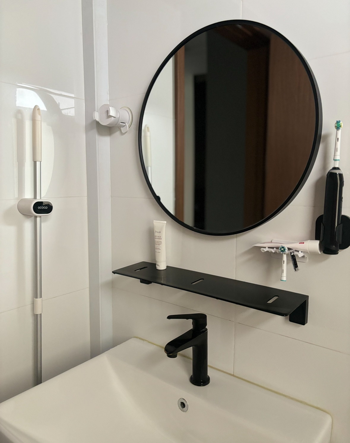 Before and After: All about the Details! - Round mirror, white tiles, black wall, bathroom sink, black faucet, white toilet