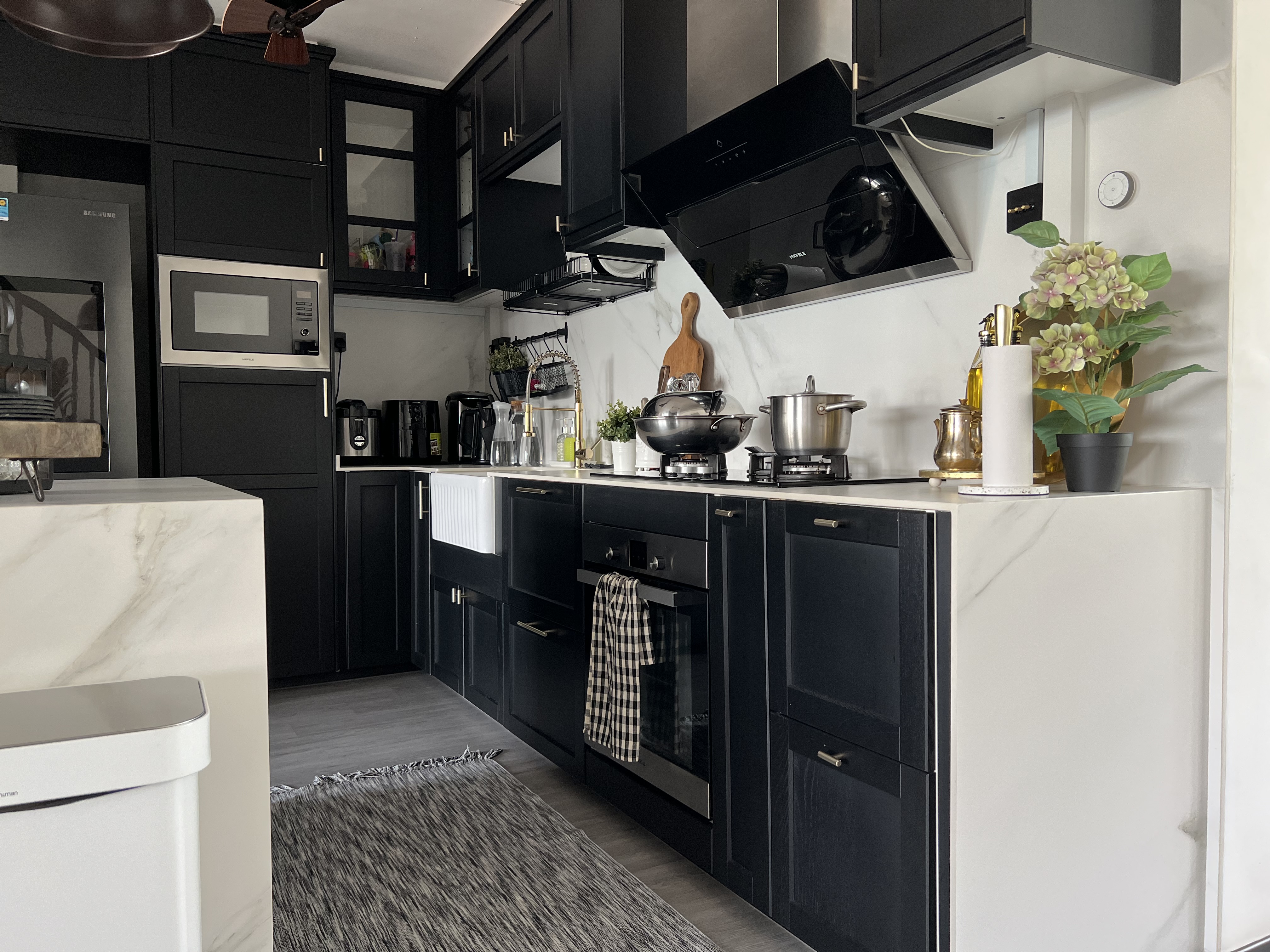 The Rustic Kitchen: Seasoned with love, to the heart’s content - black kitchen cabinetry, modern appliances, stainless steel