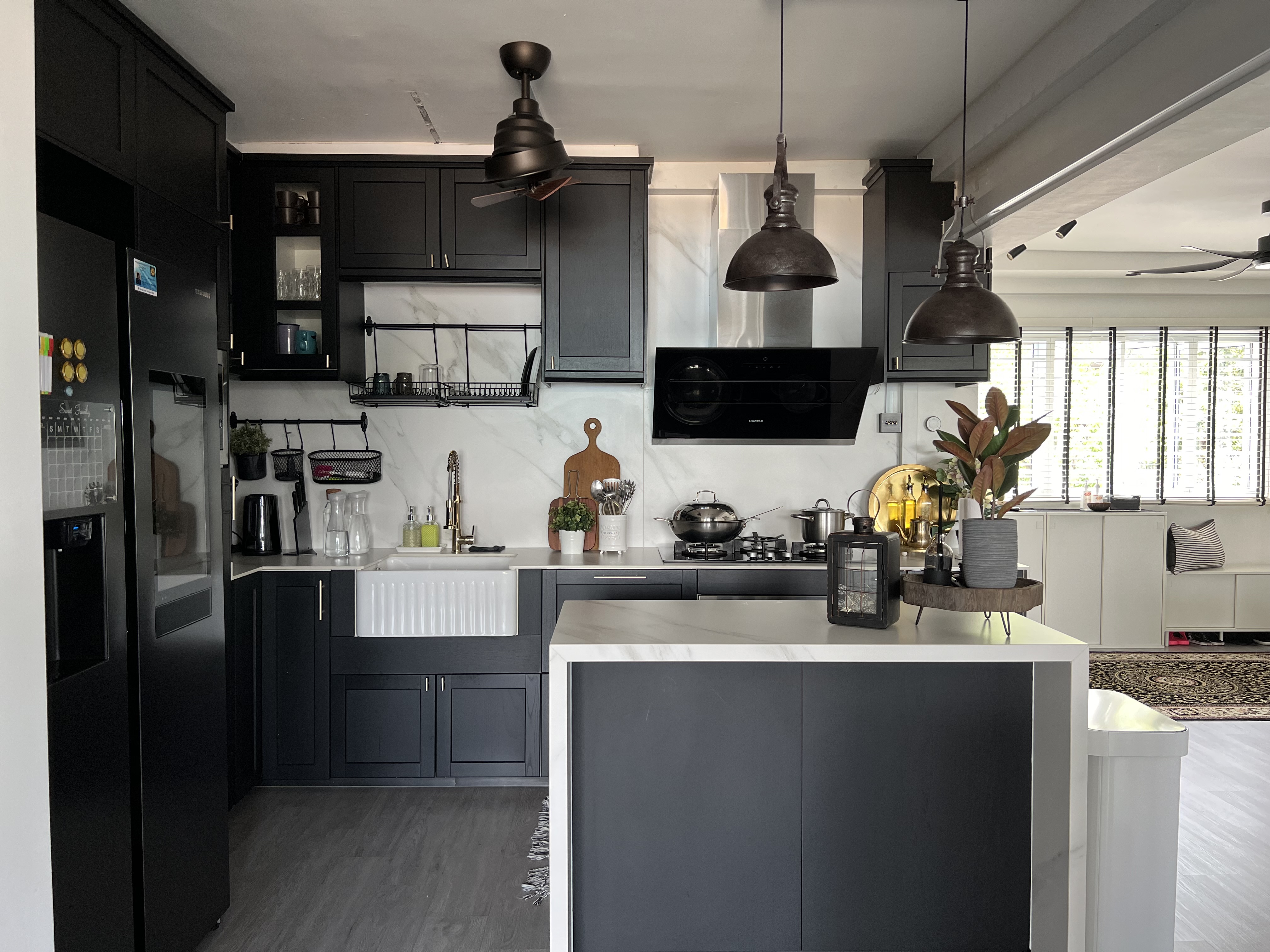 The Rustic Kitchen: Seasoned with love, to the heart’s content - Modern kitchen with sleek black cabinetry, stainless steel