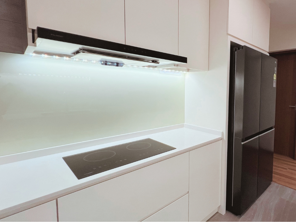 Kitchen | Chic and Functional | 5rm BTO in Tampines - White kitchen cabinetry, modern stove, black refrigerator