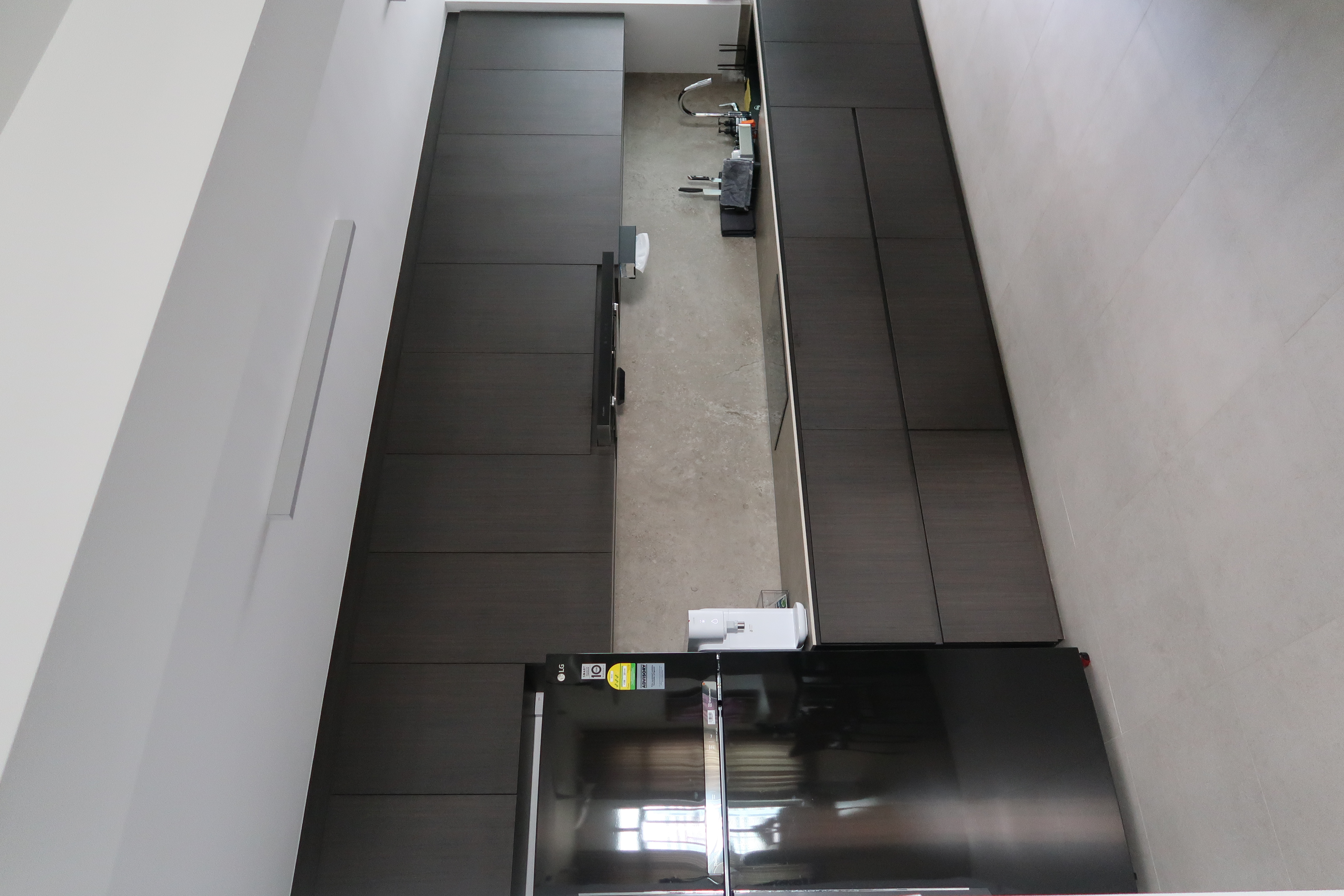 Kitchen: Dark But Functional - modern kitchen cabinetry, sleek black appliances, minimalist design, contemporary kitchen