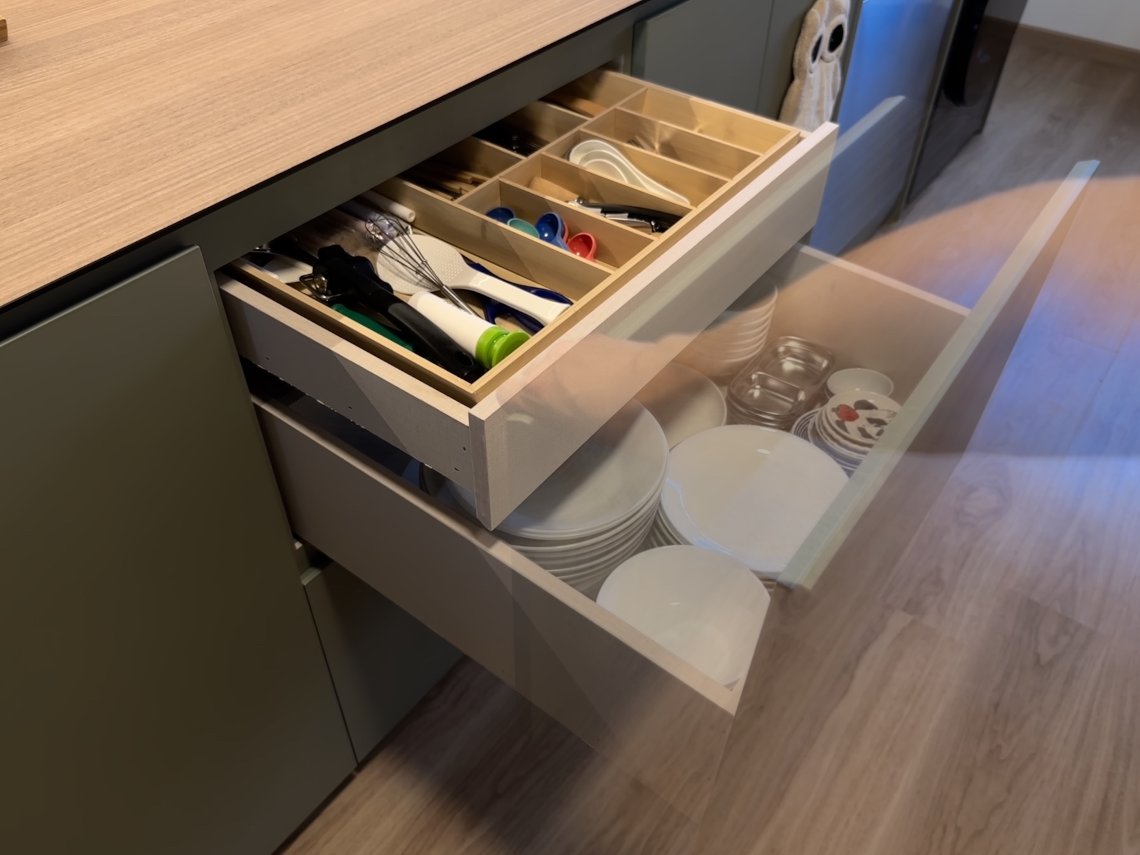 Earthy Minimalist Kitchen with Open Shelves & Maximised Storage - Wooden kitchen drawer, neatly organized utensils, white
