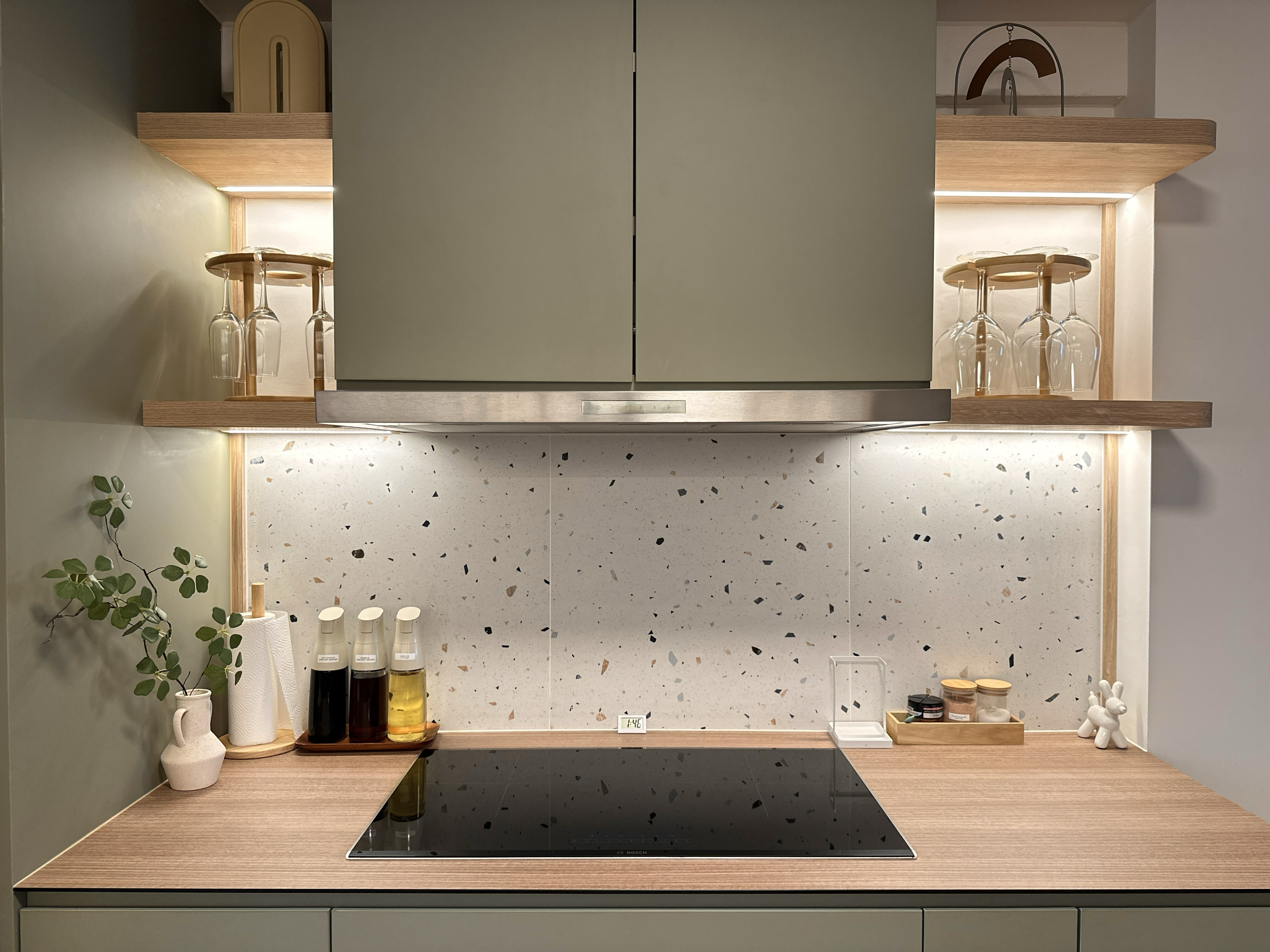 Earthy Minimalist Kitchen with Open Shelves & Maximised Storage - Wooden shelves, glassware, elegant lighting, modern