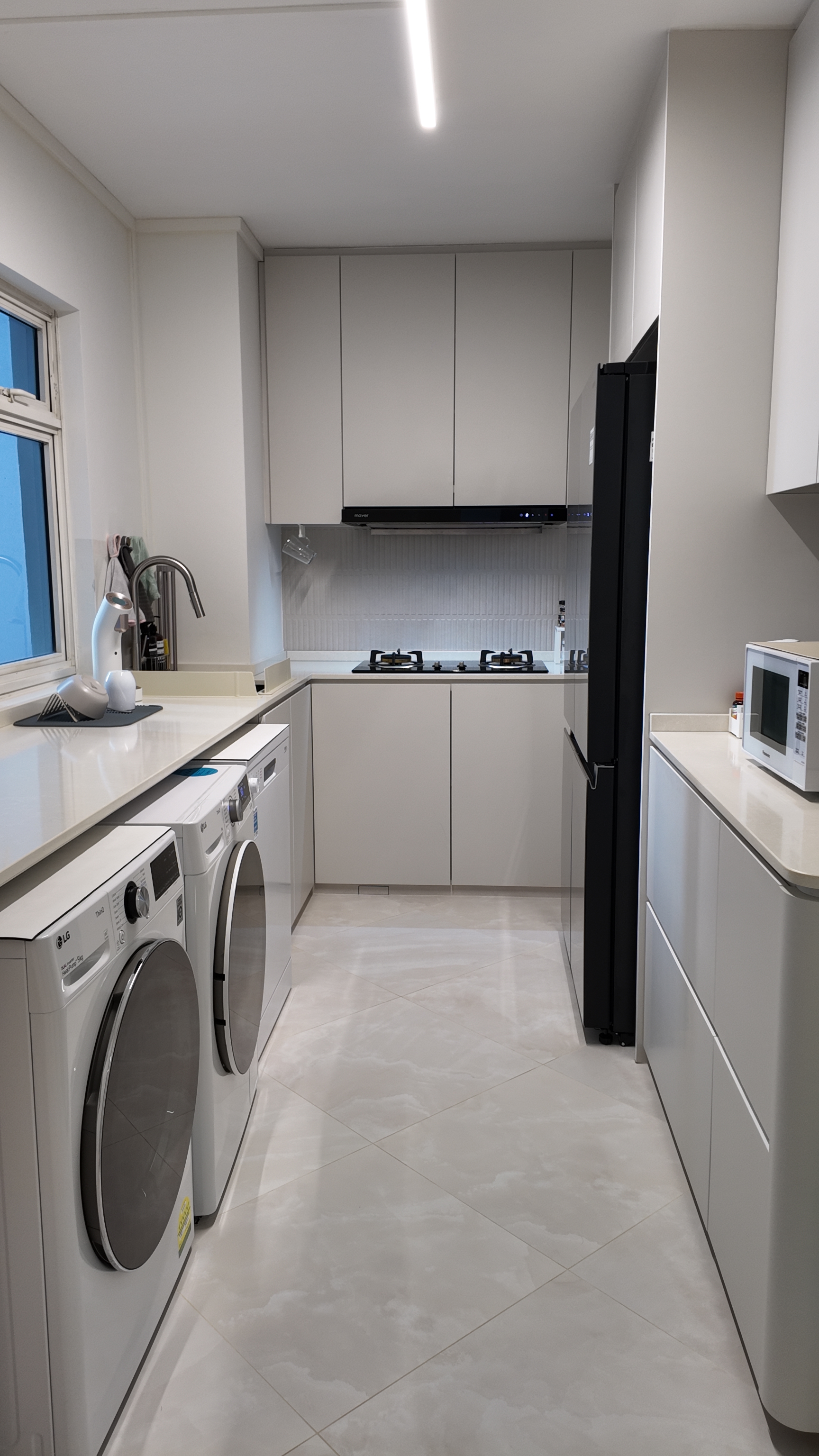Our Simple U-Shape Kitchen: Maximising Space Without a Service Yard - Modern kitchen with sleek white cabinets, stainless