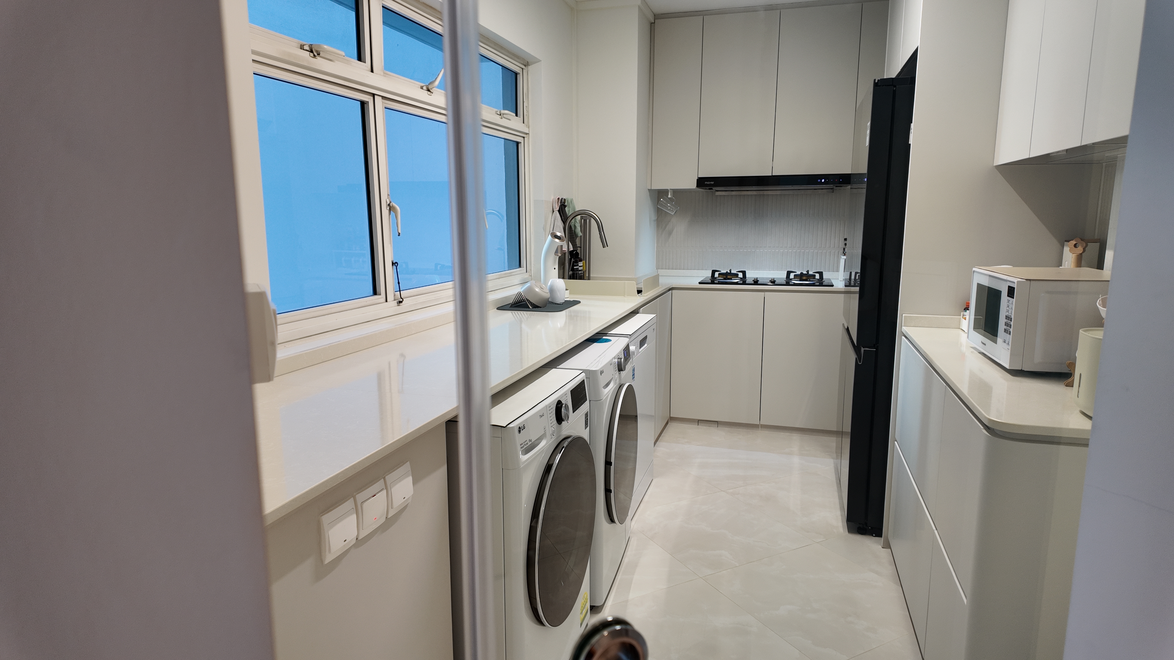 Our Simple U-Shape Kitchen: Maximising Space Without a Service Yard - Modern kitchen with white cabinetry, stainless steel