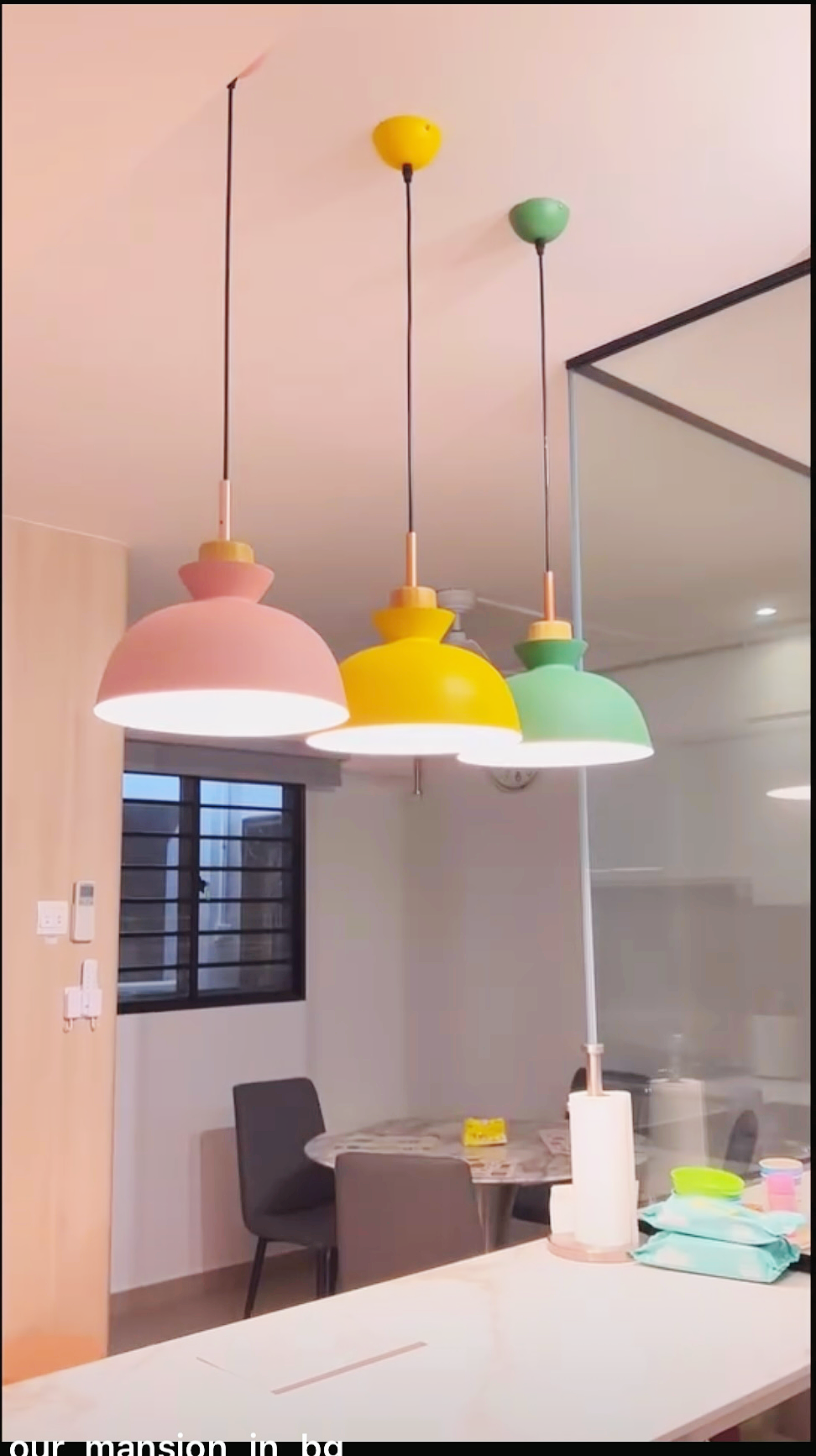 An all white kitchen separated  into wet and dry areas - modern interior, pendant lights, colorful lamps, hanging lamps
