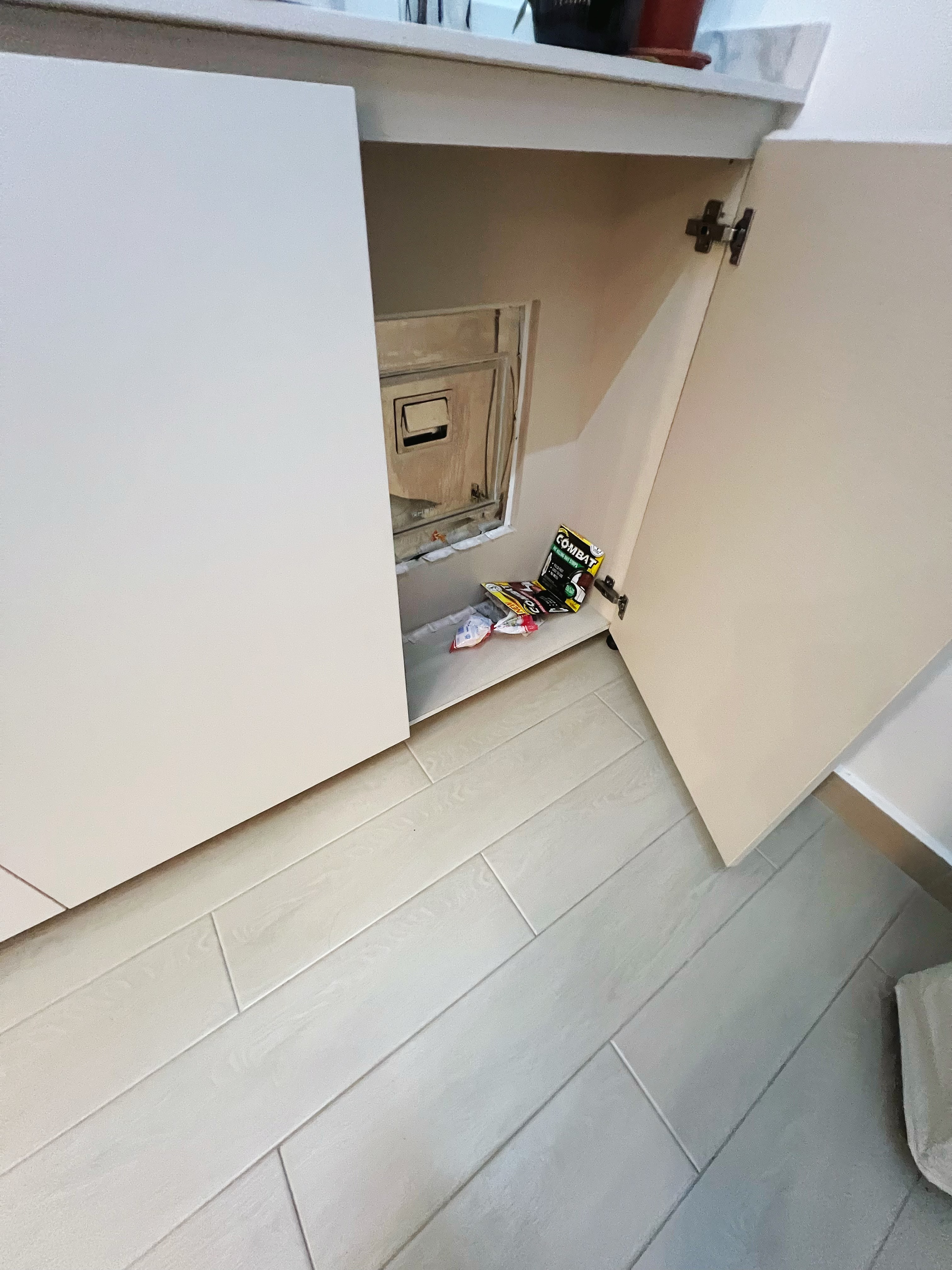 An all white kitchen separated  into wet and dry areas - Kitchen cabinet, open cabinet, under-counter space, electrical box