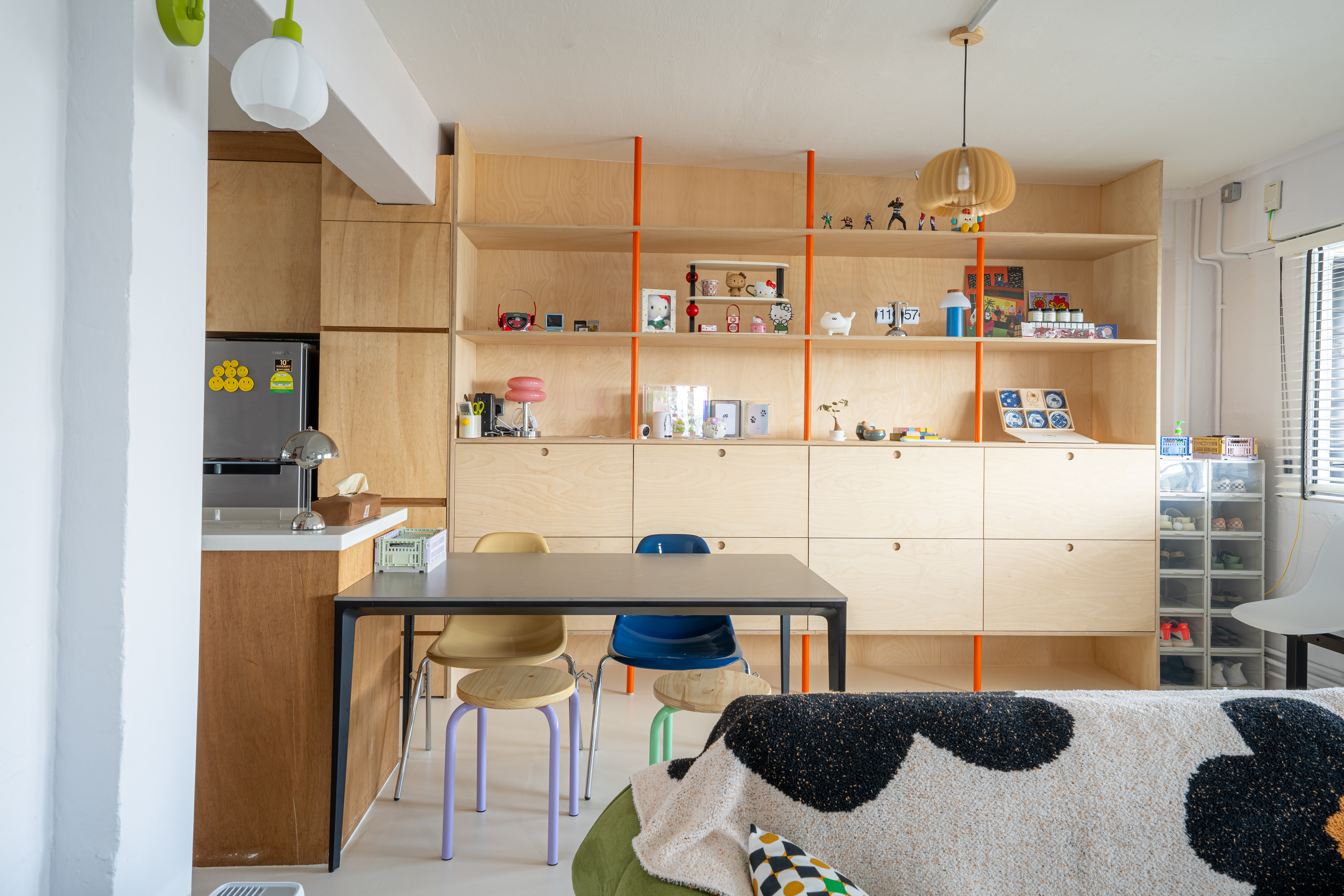 Our 2-in-1 Living Room: A space created for comfort and entertainment  - Wooden shelves, colorful decor, children's