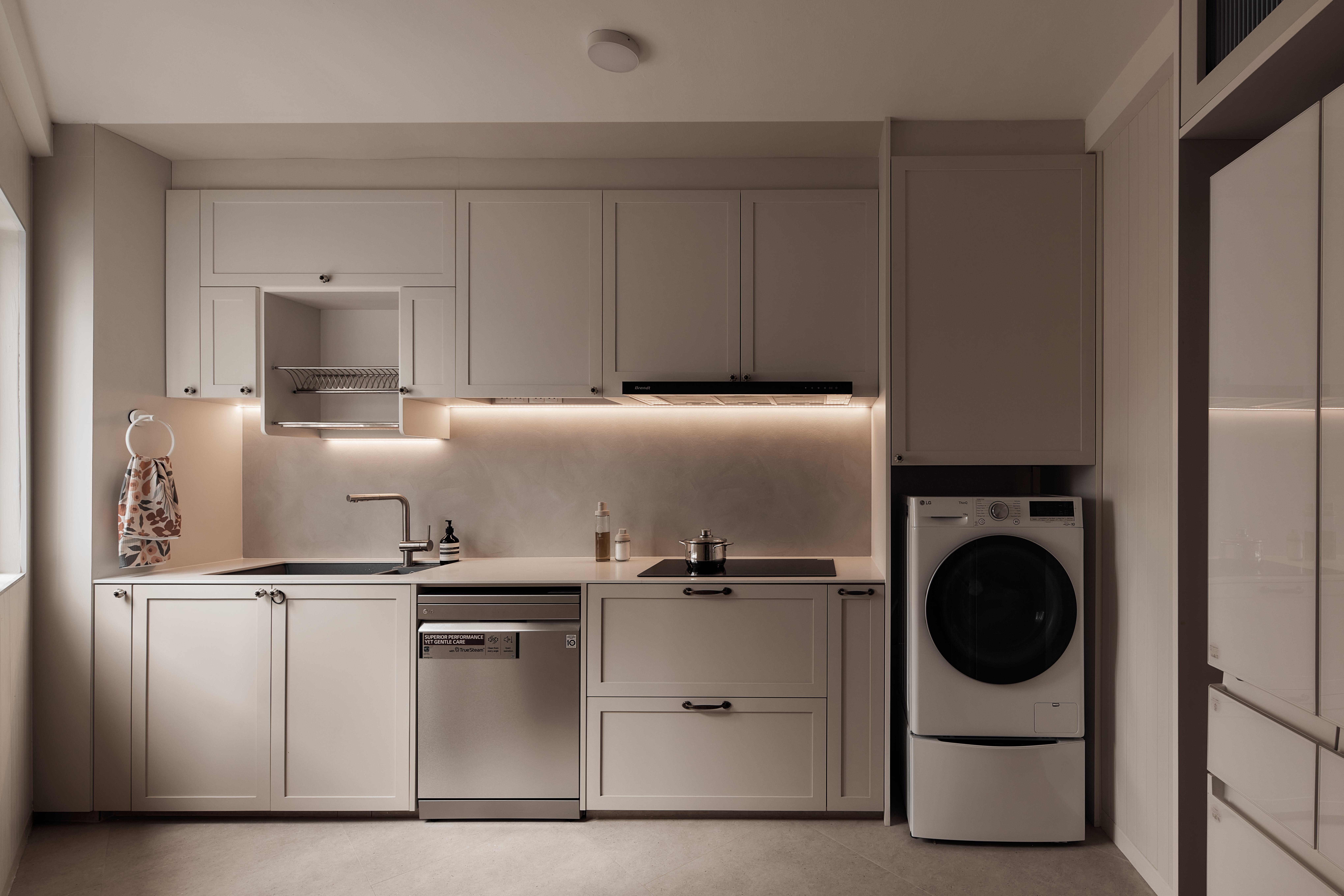 Small Kitchen, Big Ideas: Our Triangle Layout with Laundry Space - Modern kitchen with sleek cabinets, stainless steel