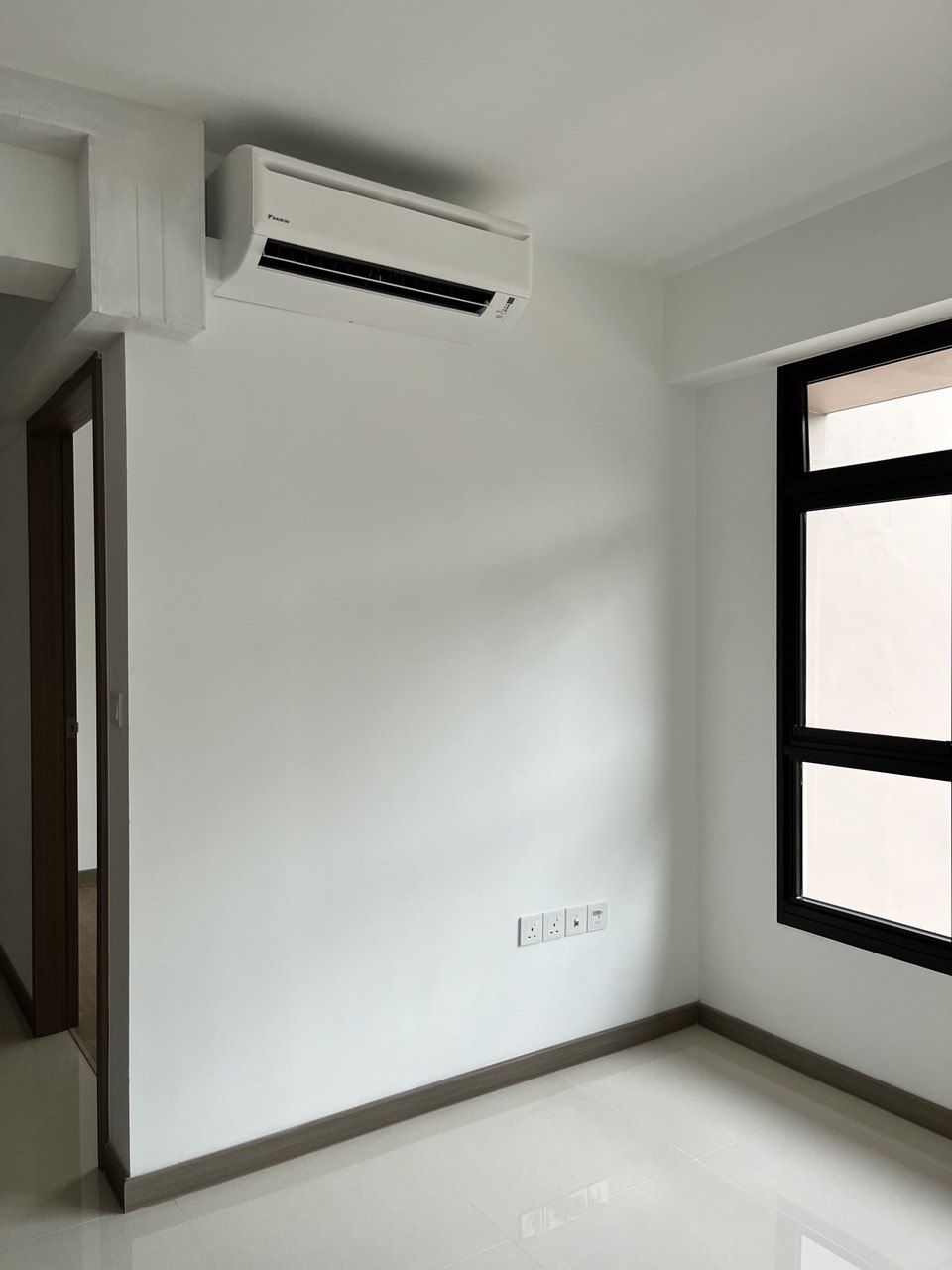 Bare to Cozy: Before & After Renovation of a 3-Room BTO Living Room - Air conditioner mounted on white wall, sleek design