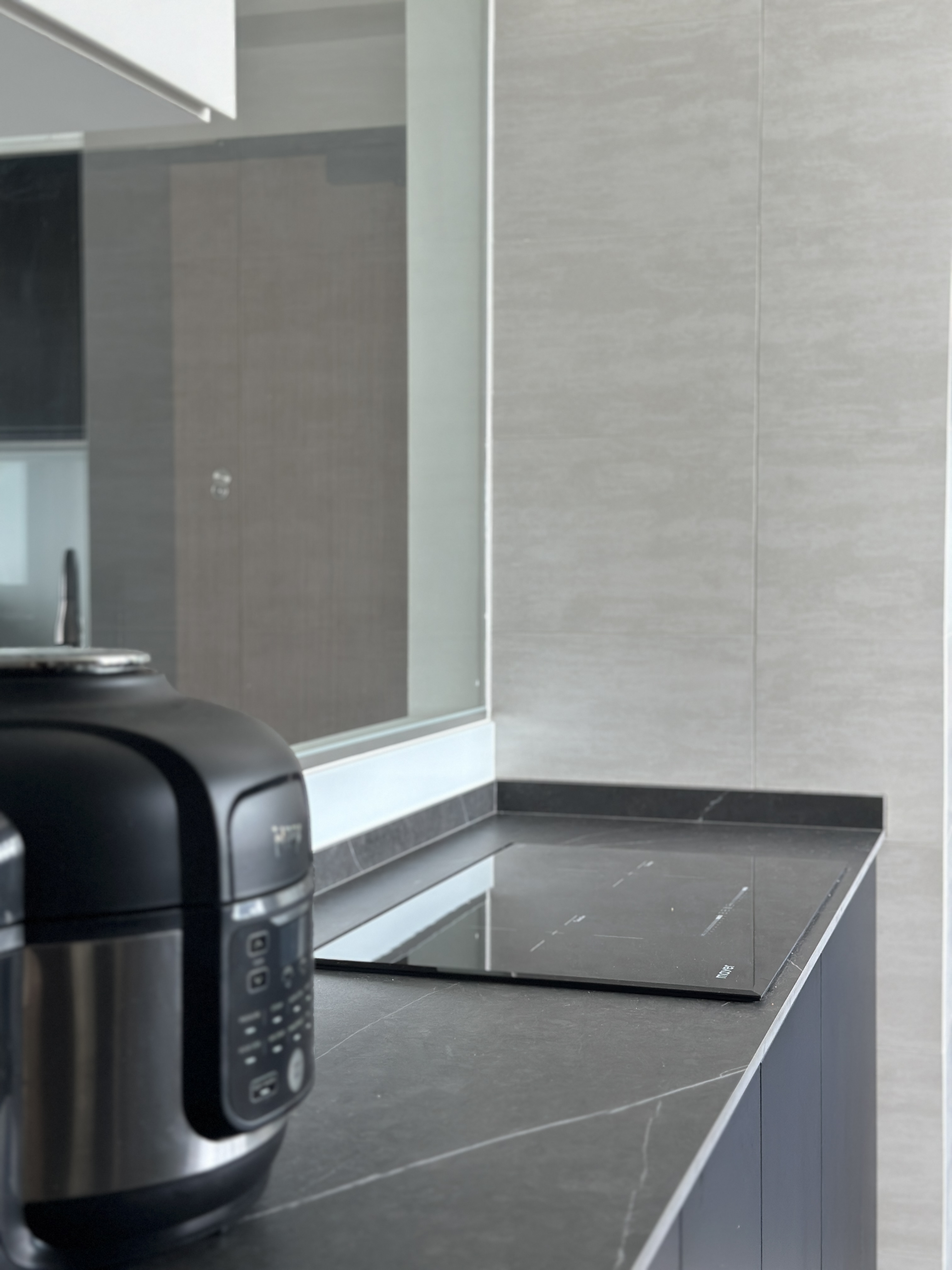 Efficient and Elegant: Our Monochrome Kitchen Design  - modern kitchen countertop, sleek black appliance, minimalist design