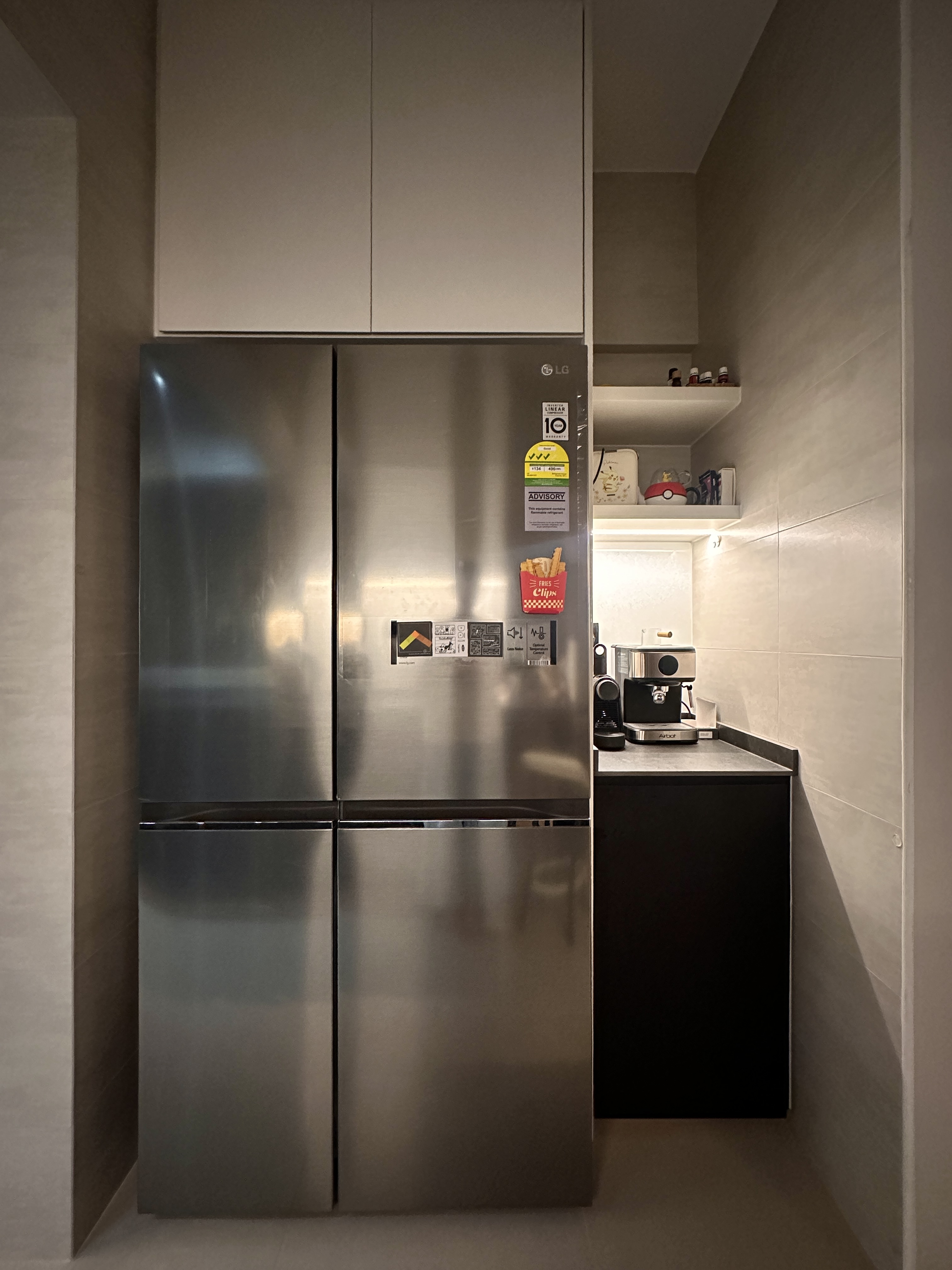 Efficient and Elegant: Our Monochrome Kitchen Design  - Stainless steel refrigerator, modern kitchen, integrated cabinetry