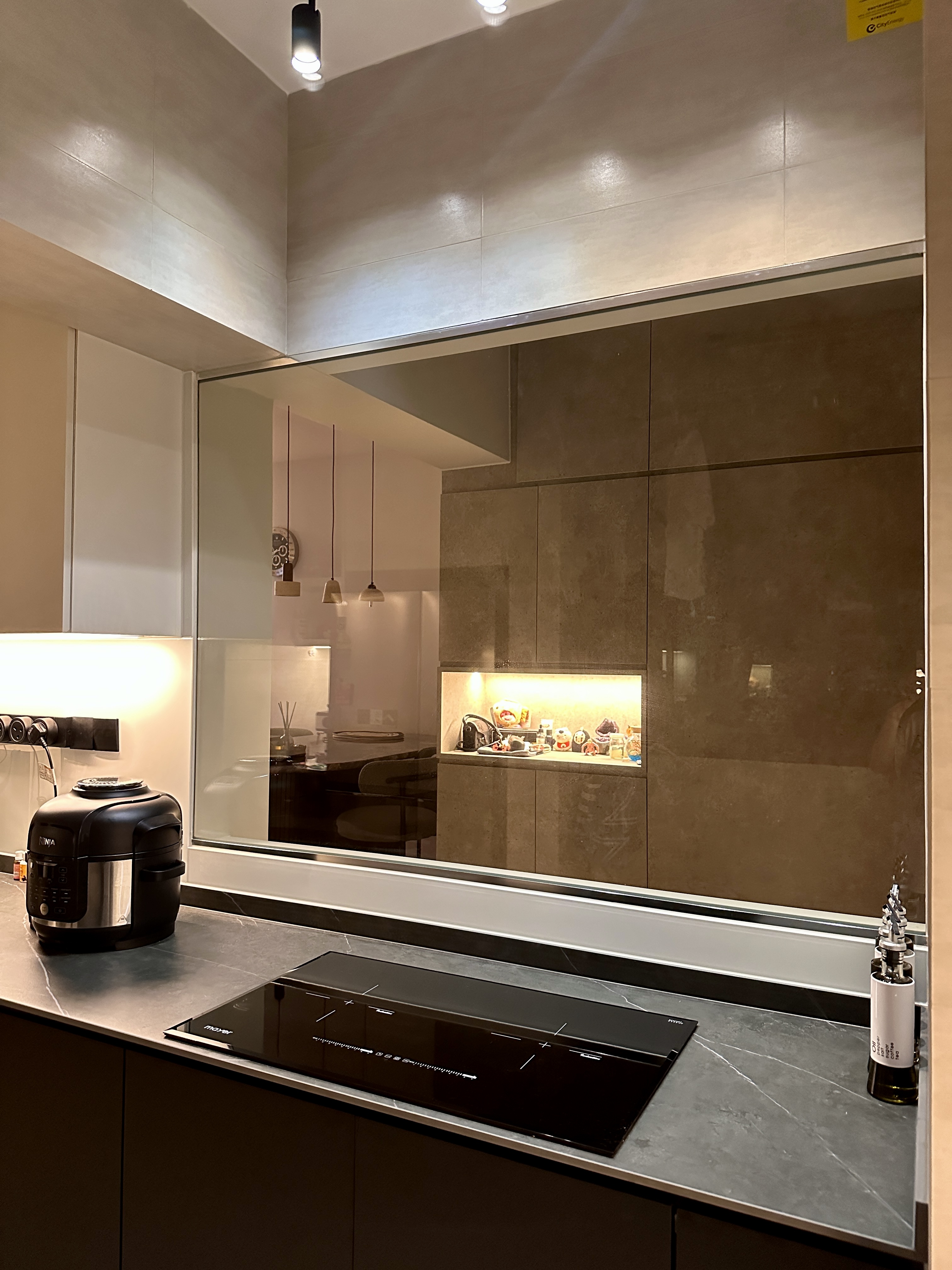 Efficient and Elegant: Our Monochrome Kitchen Design  - Modern kitchen with sleek black appliances, minimalist design, large