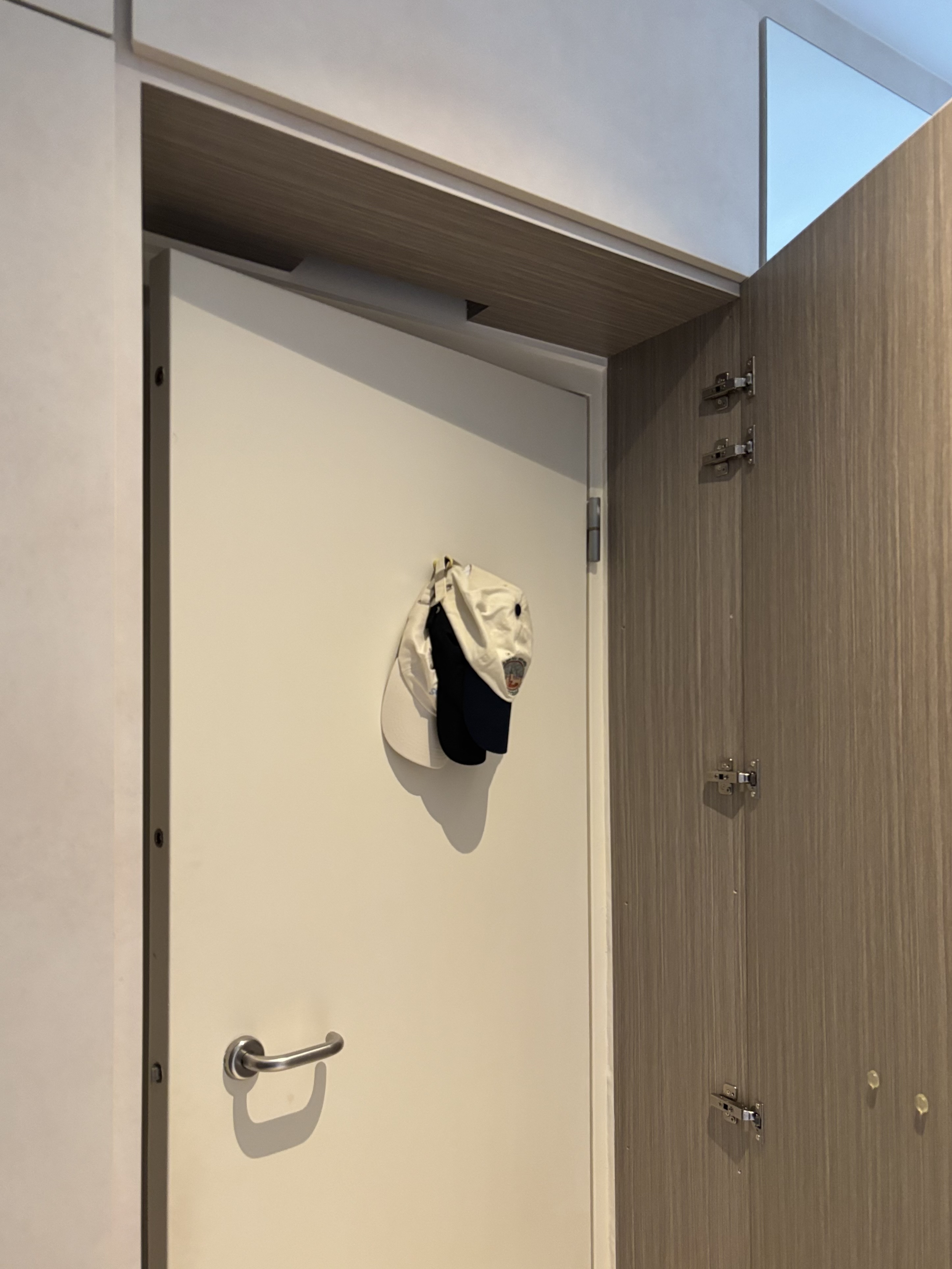 Entryway: Minimal look with concealed carpentry in a 4-rm BTO - Wooden door, white door, metal handle, hanging hats