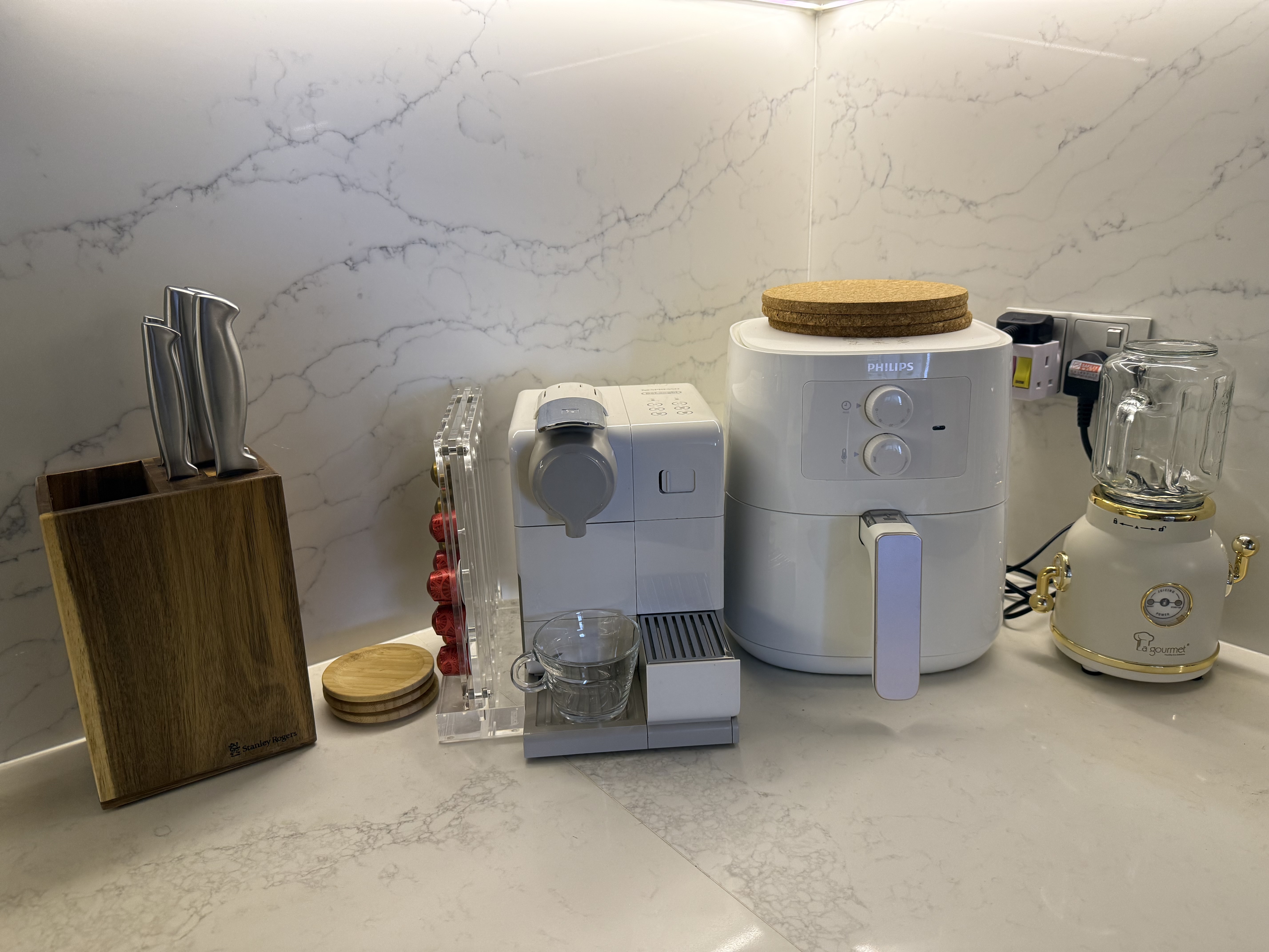 Our Kitchen: Minimalist and Cozy!  - White Philips coffee machine, wooden cutting board, clear glass pitcher, stainless steel