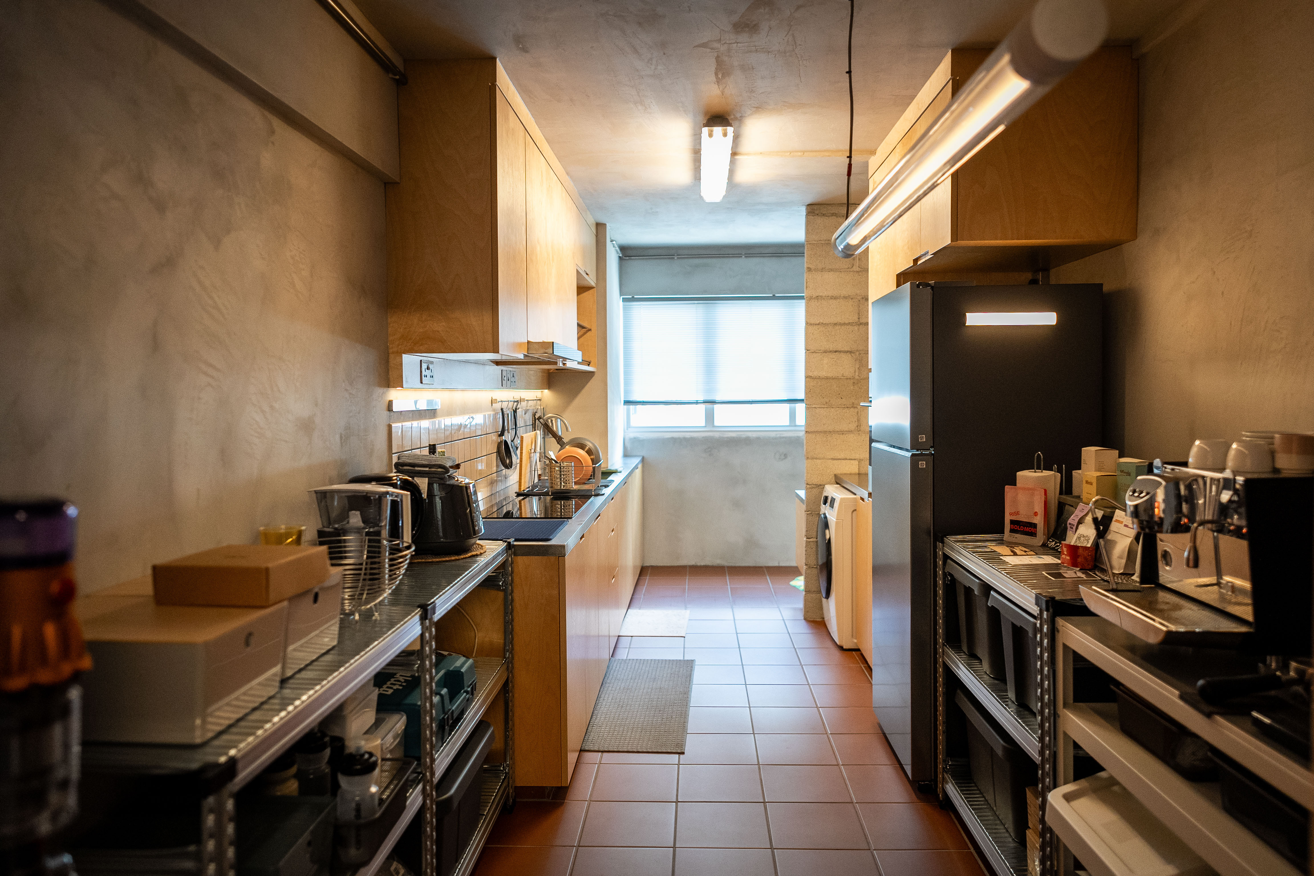 A Coffee Lover's Spacious & Charming Kitchen - Modern kitchen with wooden cabinets, stainless steel appliances, tiled floor