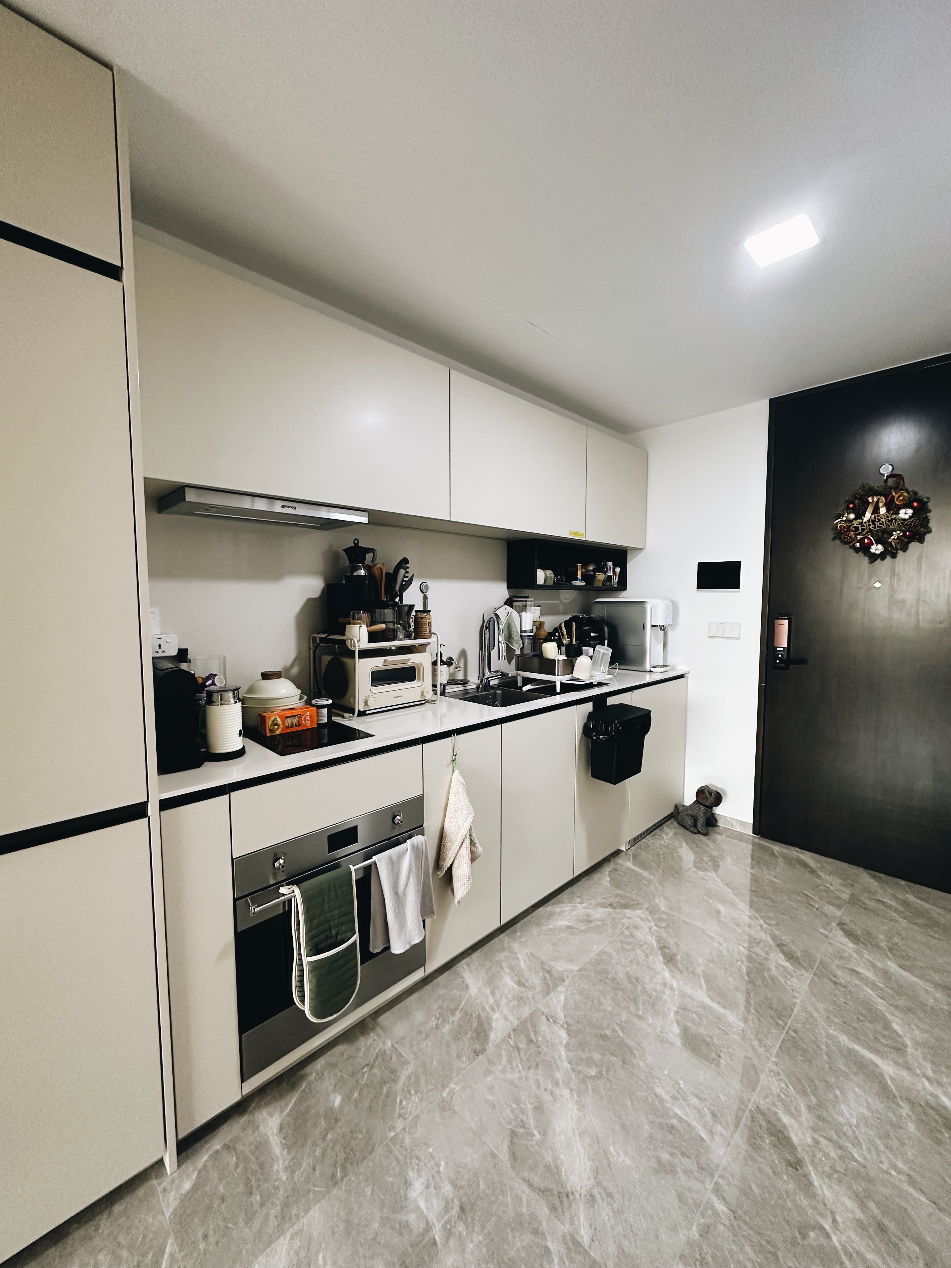 Maximizing Function in a Minimalist Kitchen: Our Small Cooking Haven  - White kitchen cabinetry, modern appliances, stainless
