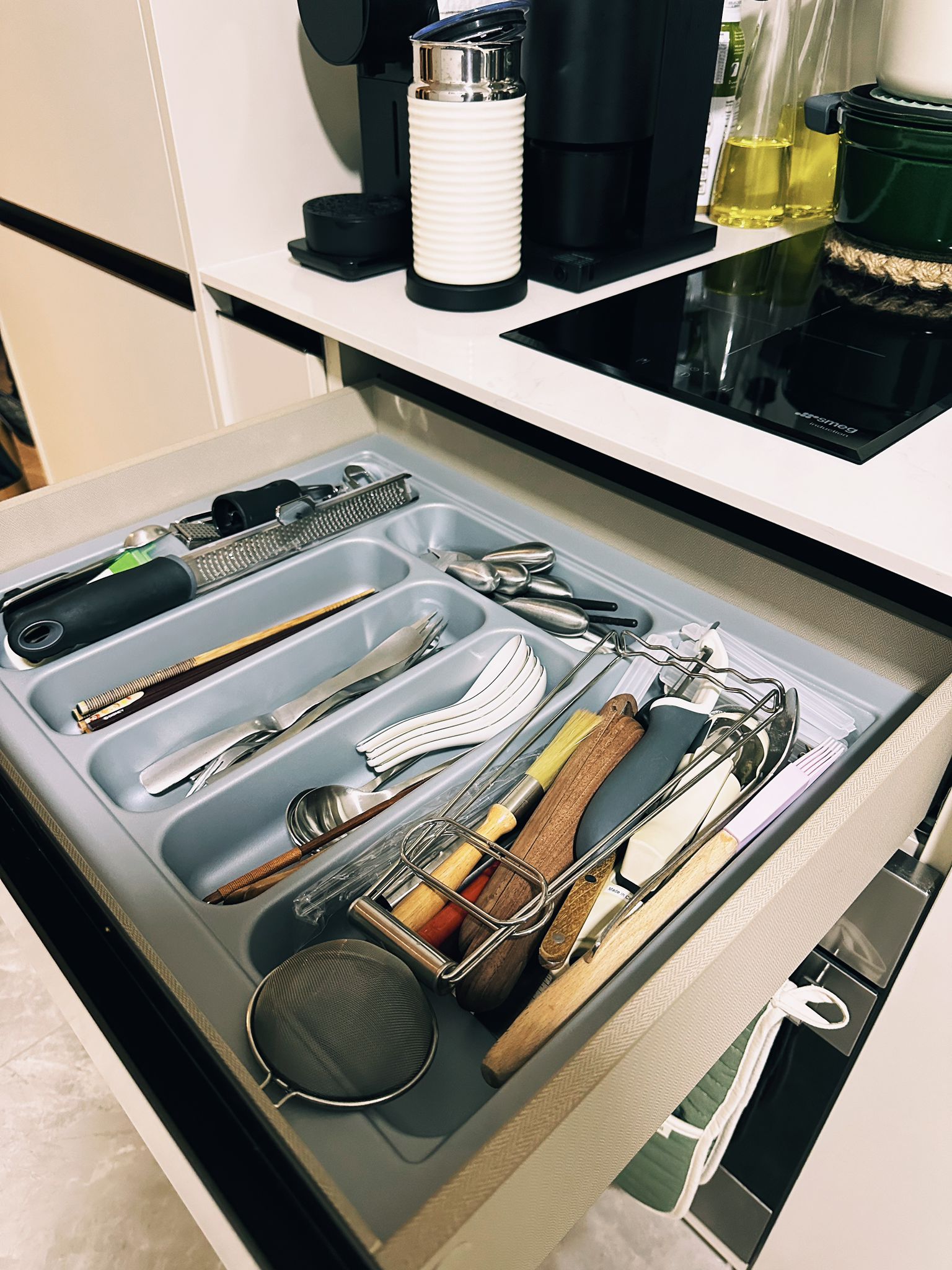Maximizing Function in a Minimalist Kitchen: Our Small Cooking Haven  - storage bin, kitchen drawer, neatly organized