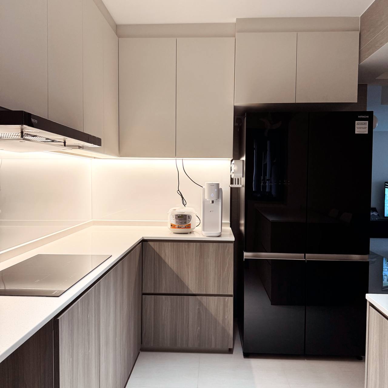 Inside Our Open Concept Kitchen: Practical & Functional - Modern kitchen with sleek cabinets, under-cabinet lighting, white