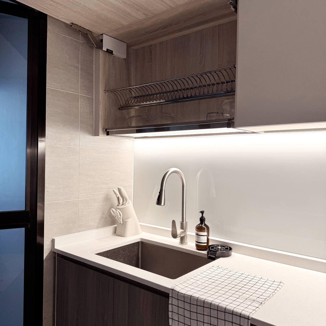Inside Our Open Concept Kitchen: Practical & Functional - Modern kitchen sink, sleek faucet, under-cabinet lighting, white