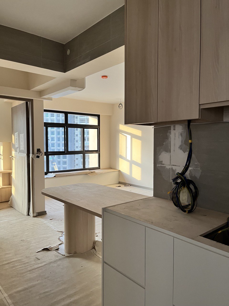 Before & After: Transforming the Impossible of a Small Kitchen Space  - Modern kitchen under renovation, large window with