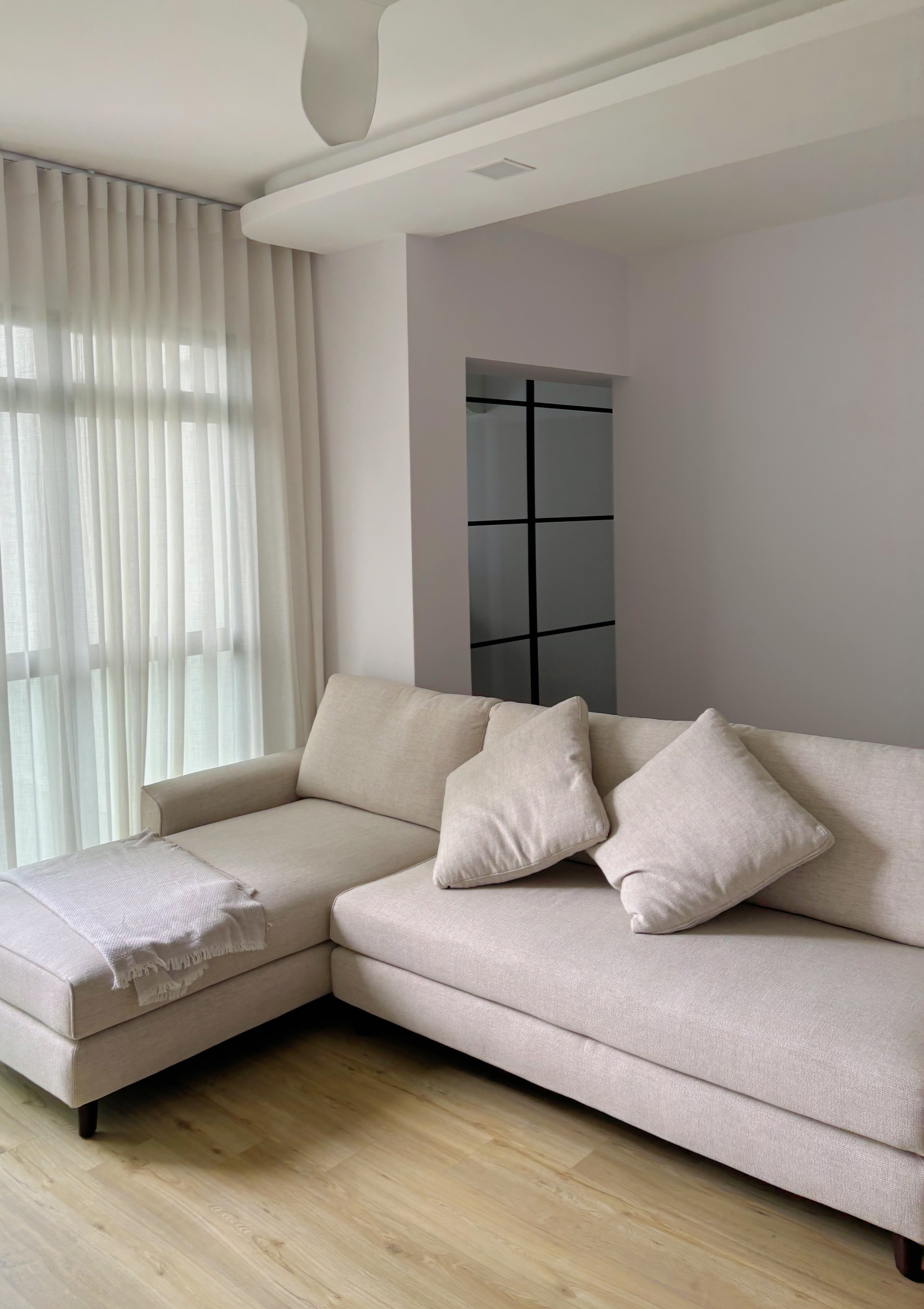 Space to Breathe: Minimalist & Calming 5rm AMK Resale HDB - Light beige sofa, light wooden floor, sheer curtains, modern