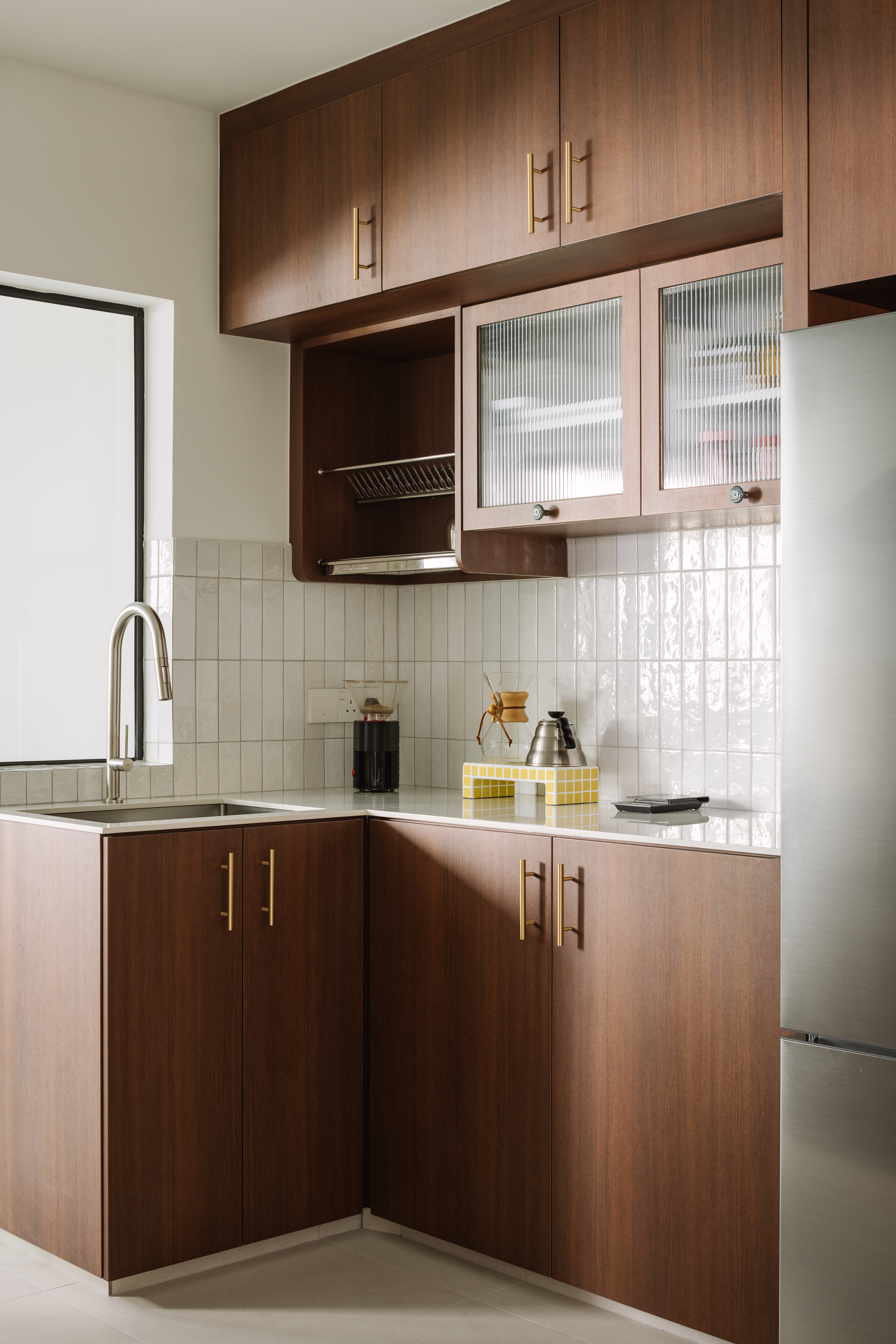 Working Around a Compact Kitchen with an Extended Dry Pantry - Modern kitchen with wooden cabinets, stainless steel