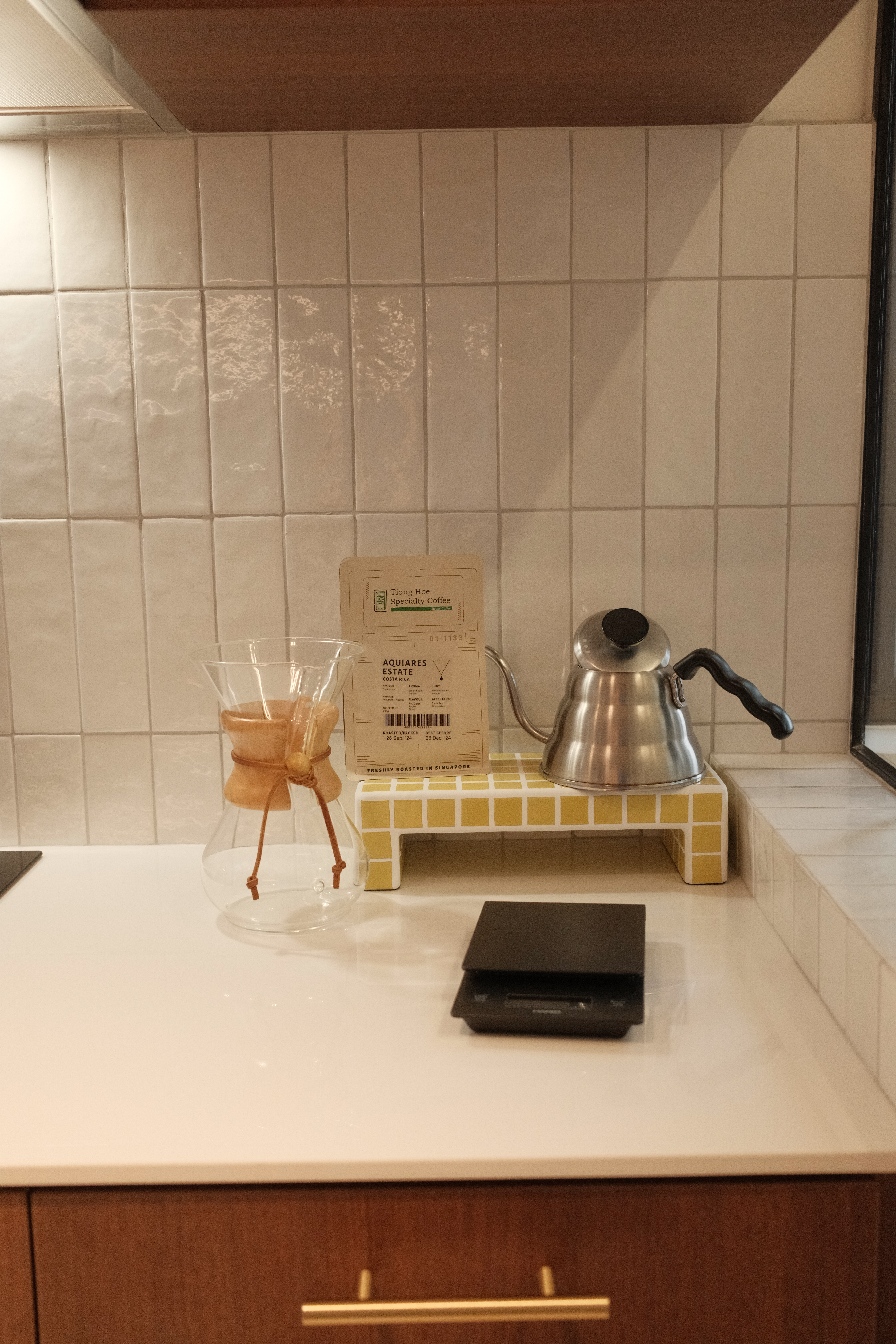 Working Around a Compact Kitchen with an Extended Dry Pantry - White tiled kitchen countertop, modern kitchen appliances