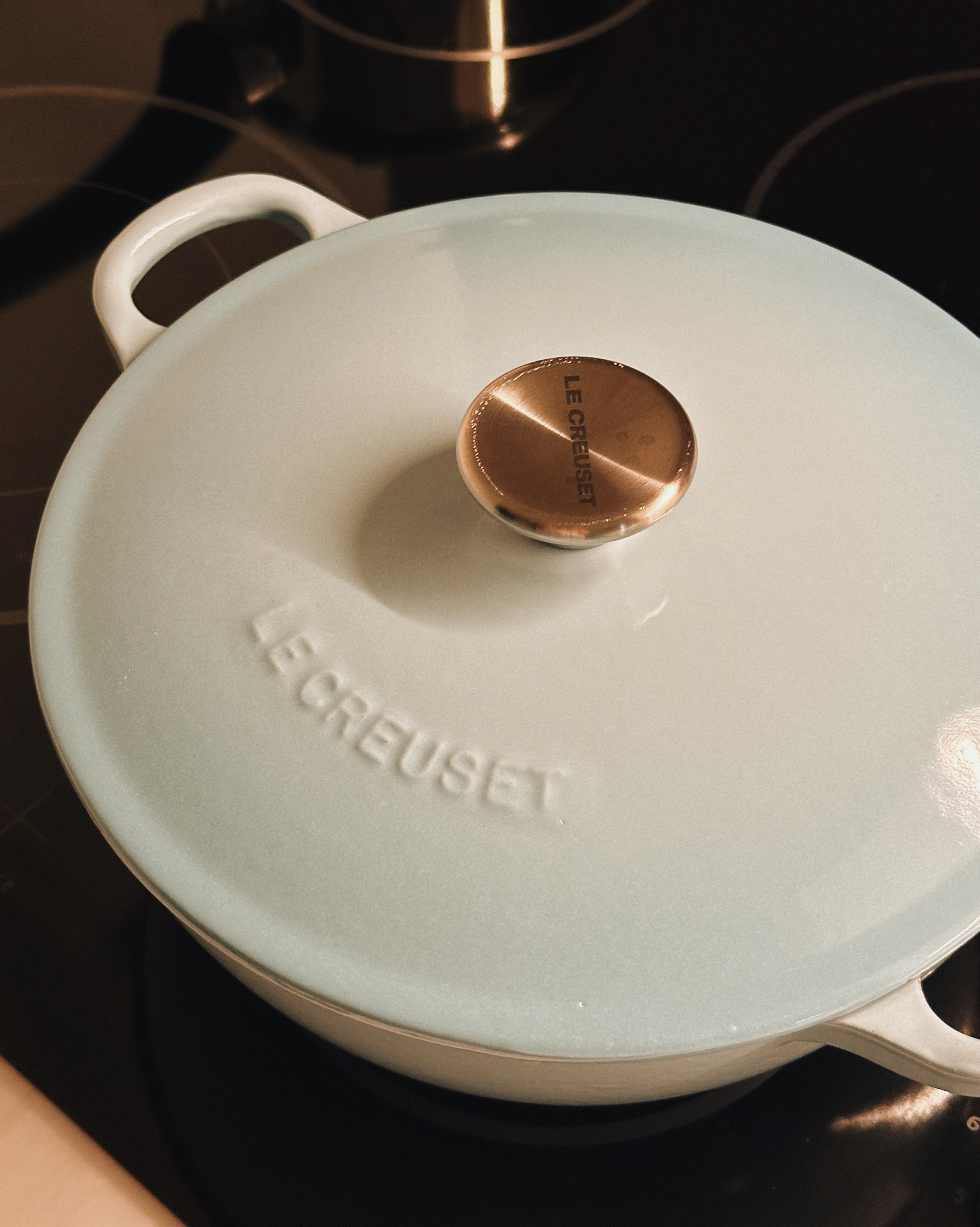 Minimalist Kitchen Essentials: Making the Most of Small Condo Spaces - Light blue, ceramic, lid, round, handle, "LE CREUSET"