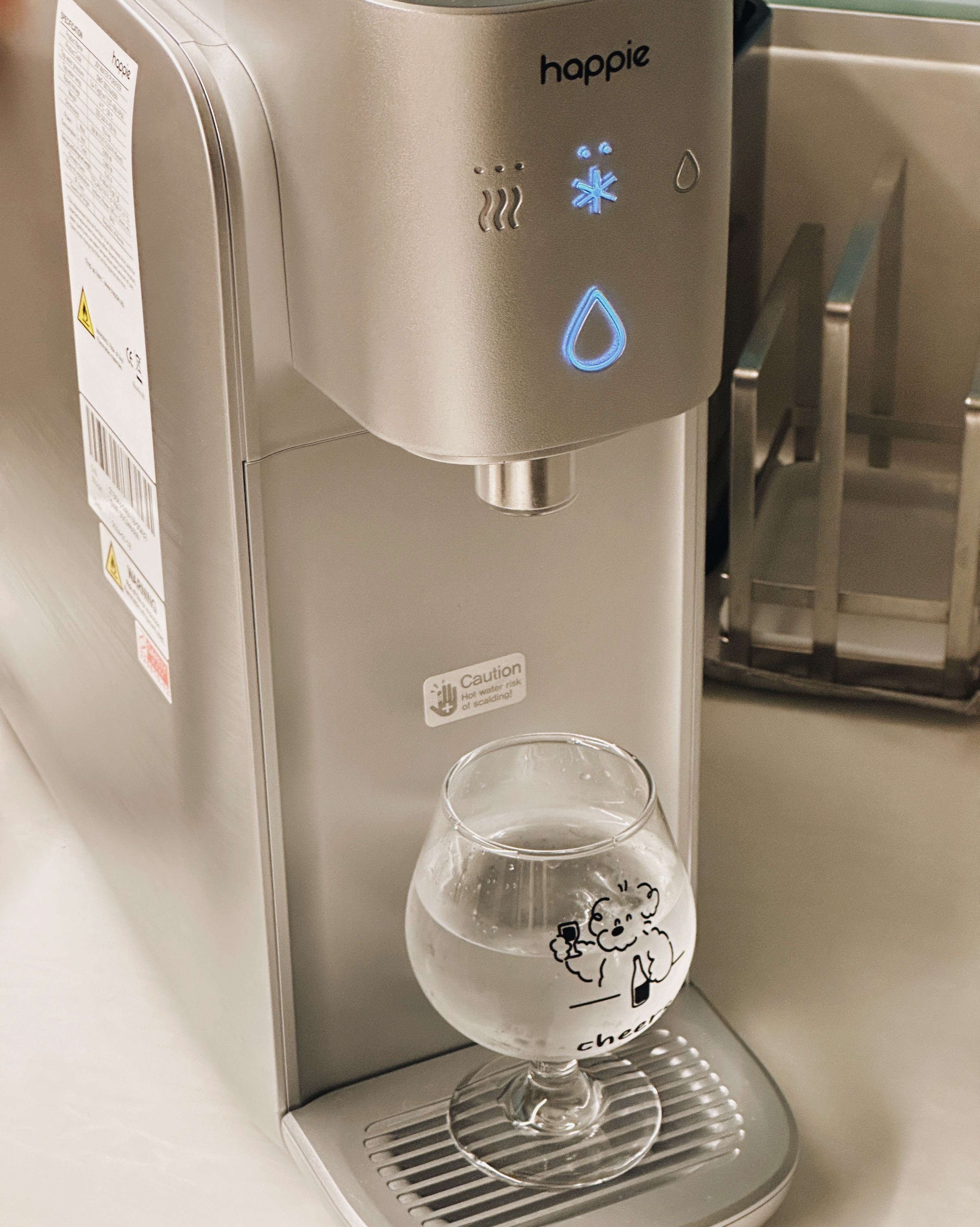 Minimalist Kitchen Essentials: Making the Most of Small Condo Spaces - smart water dispenser, automatic water flow, glass