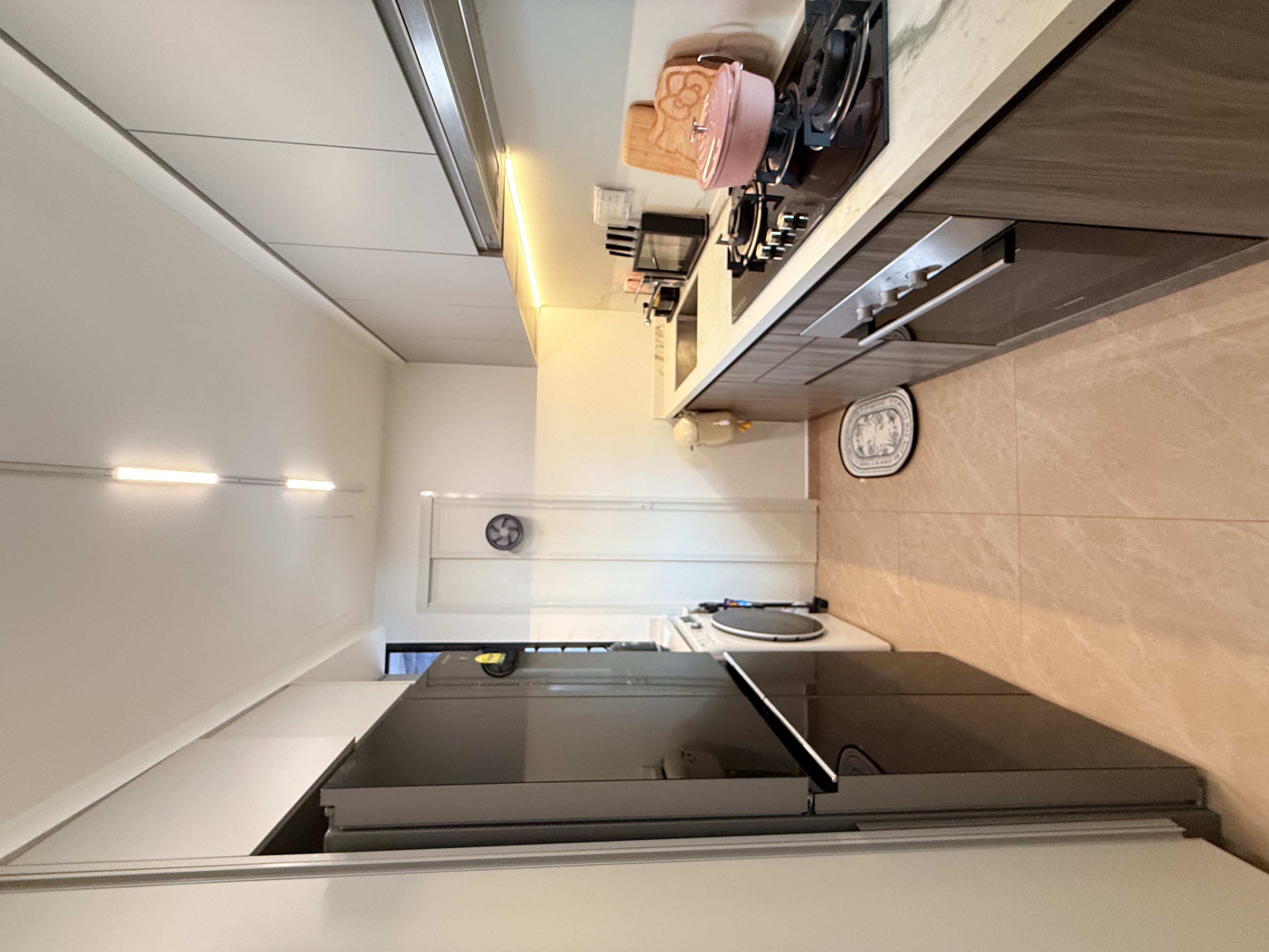 Our Gallery Kitchen: Yay or Nay?  - Modern kitchen with sleek design, white and beige color scheme, built-in oven and stove