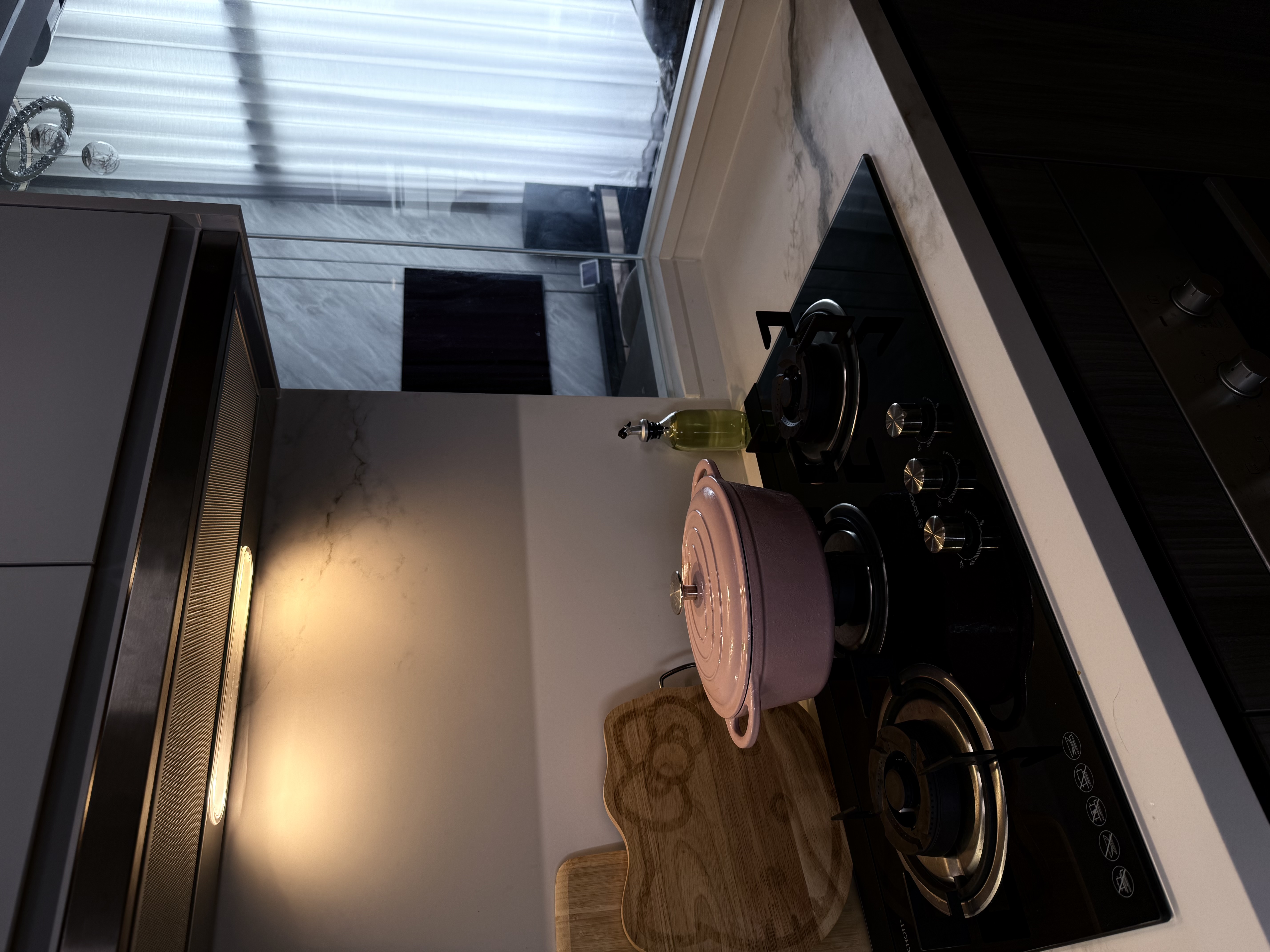 Our Gallery Kitchen: Yay or Nay?  - Modern kitchen countertop, stainless steel appliances, black stove, pink pot on cutting