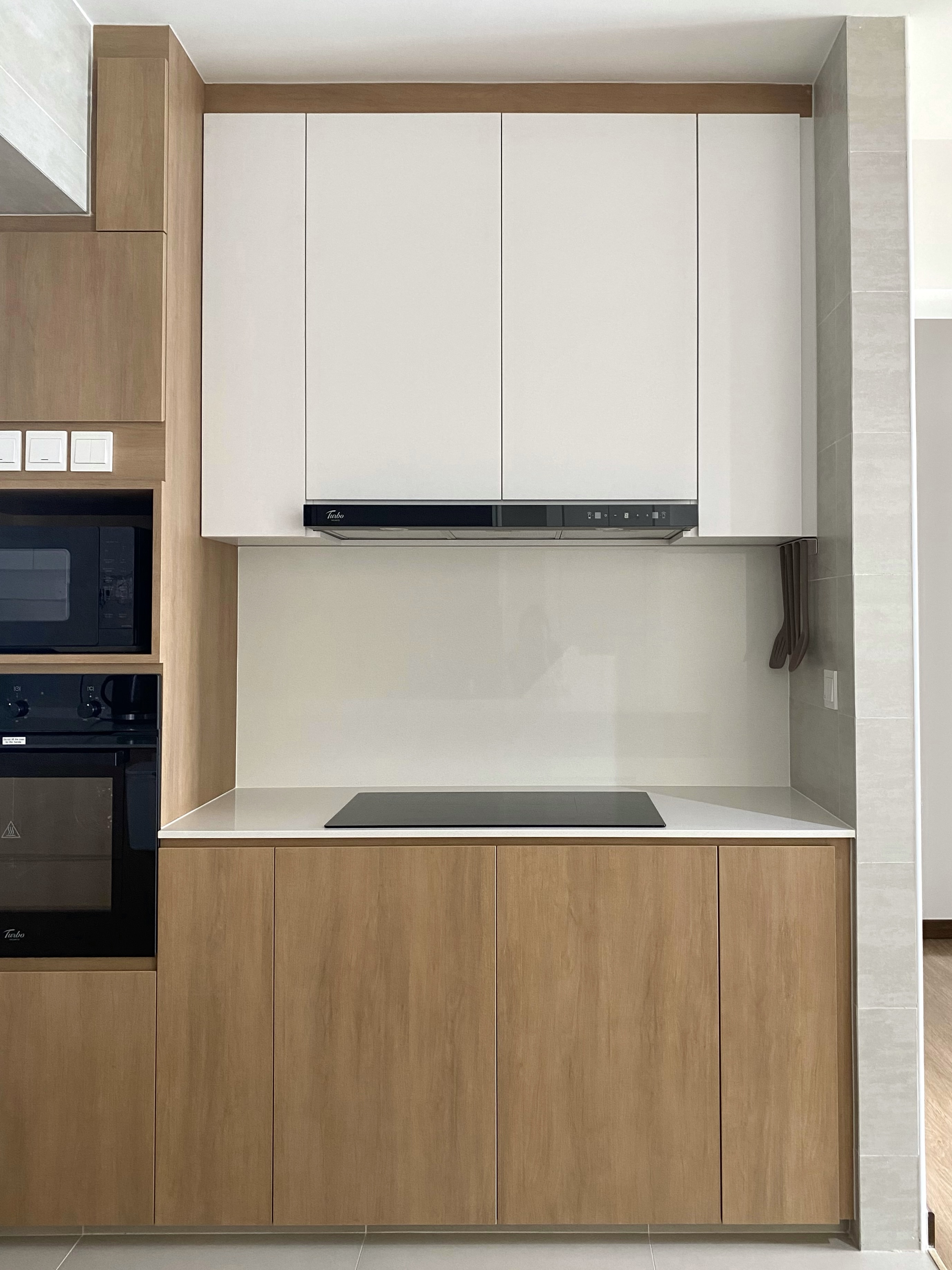 Kitchen: Multifunctional Space Combining Laundry and Cooking Area - Wooden cabinetry, sleek design, modern kitchen