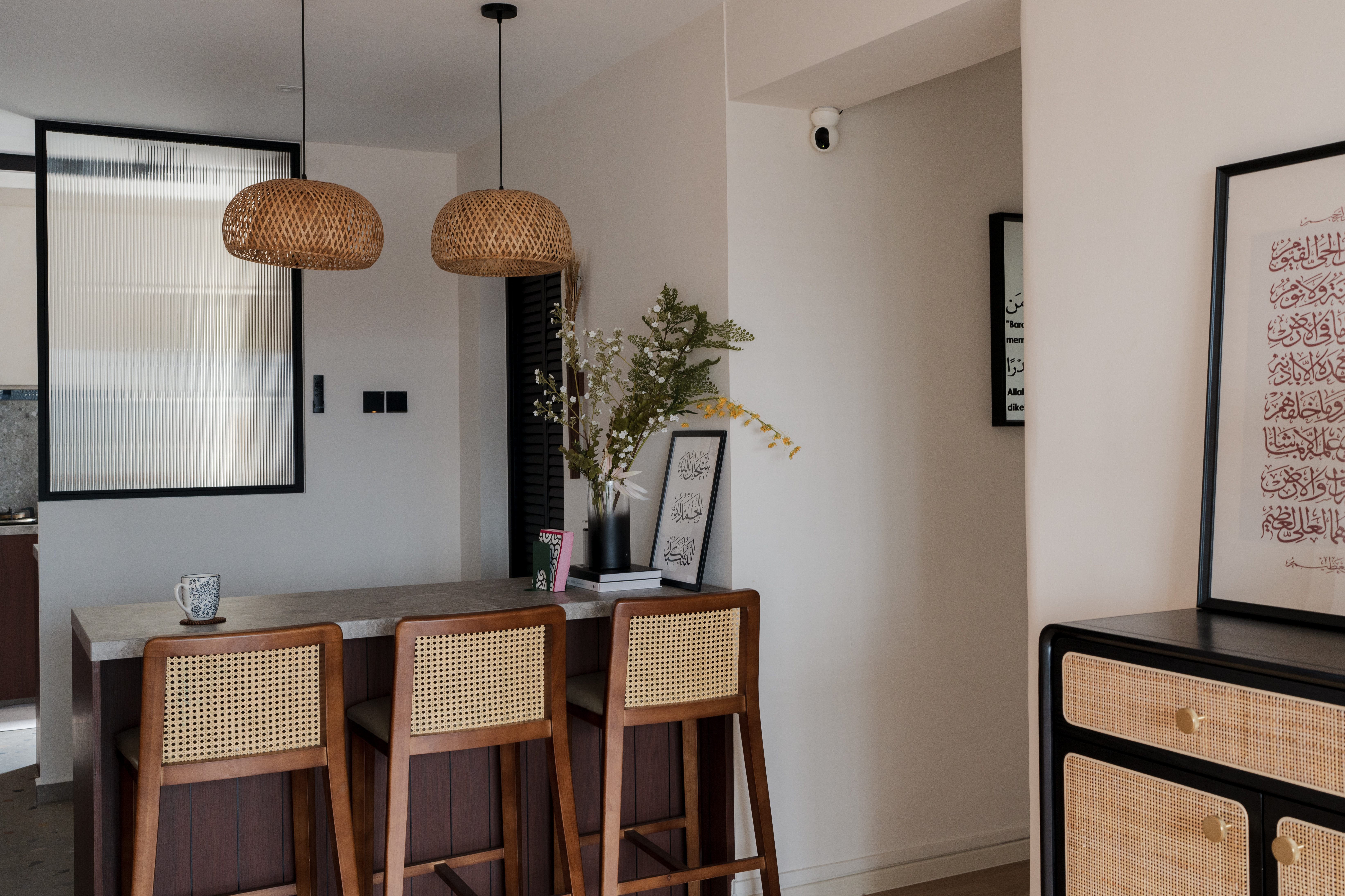 Our open concept kitchen: Warm wood meets terrazzo! ✨🤍 - Modern minimalist kitchen with woven pendant lights, wooden bar