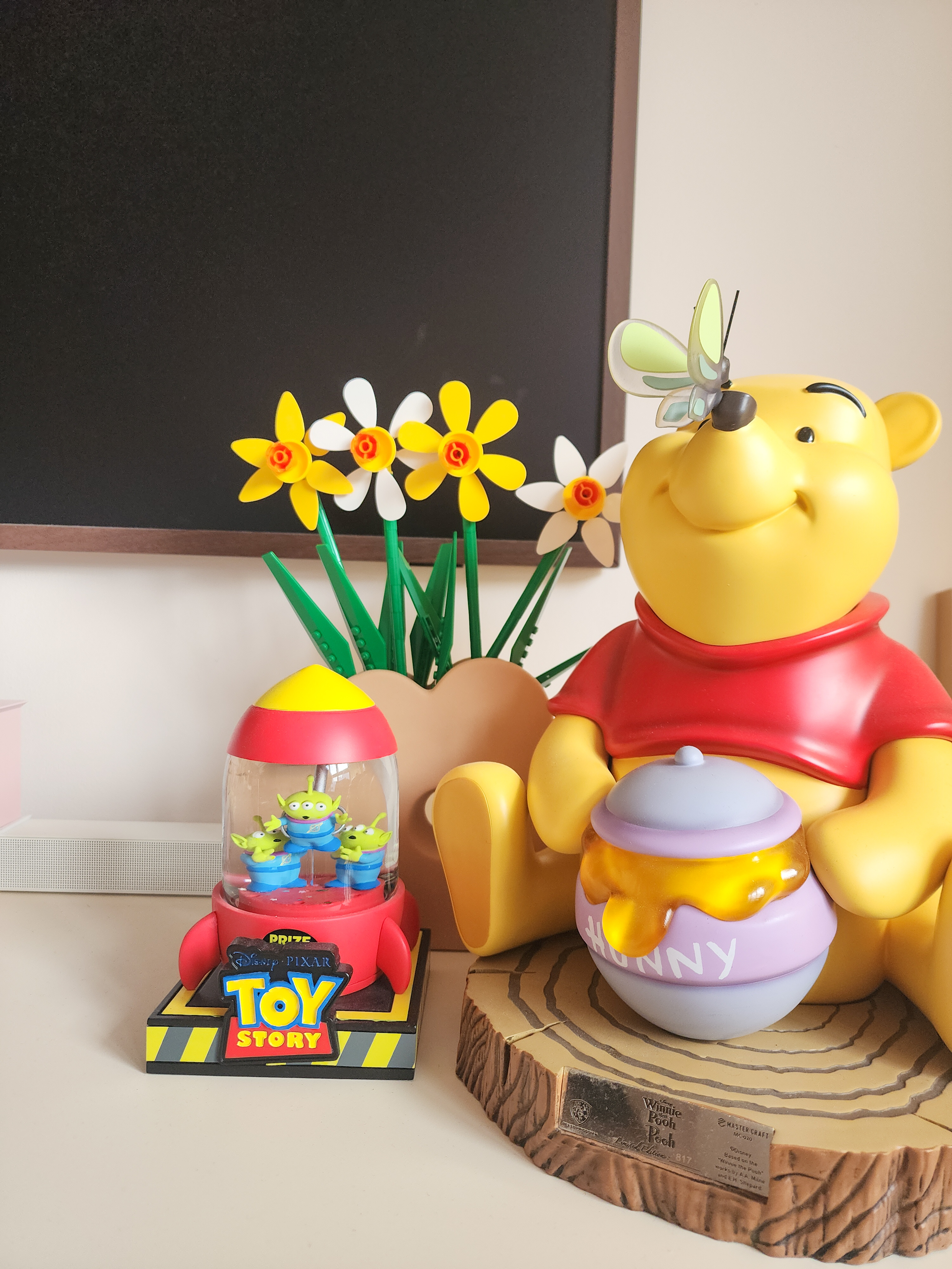 Our Cosy Living Room: ZERO CARPENTRY & Hints of Disney Magic! - Winnie the Pooh toy set with a smiling yellow bear character