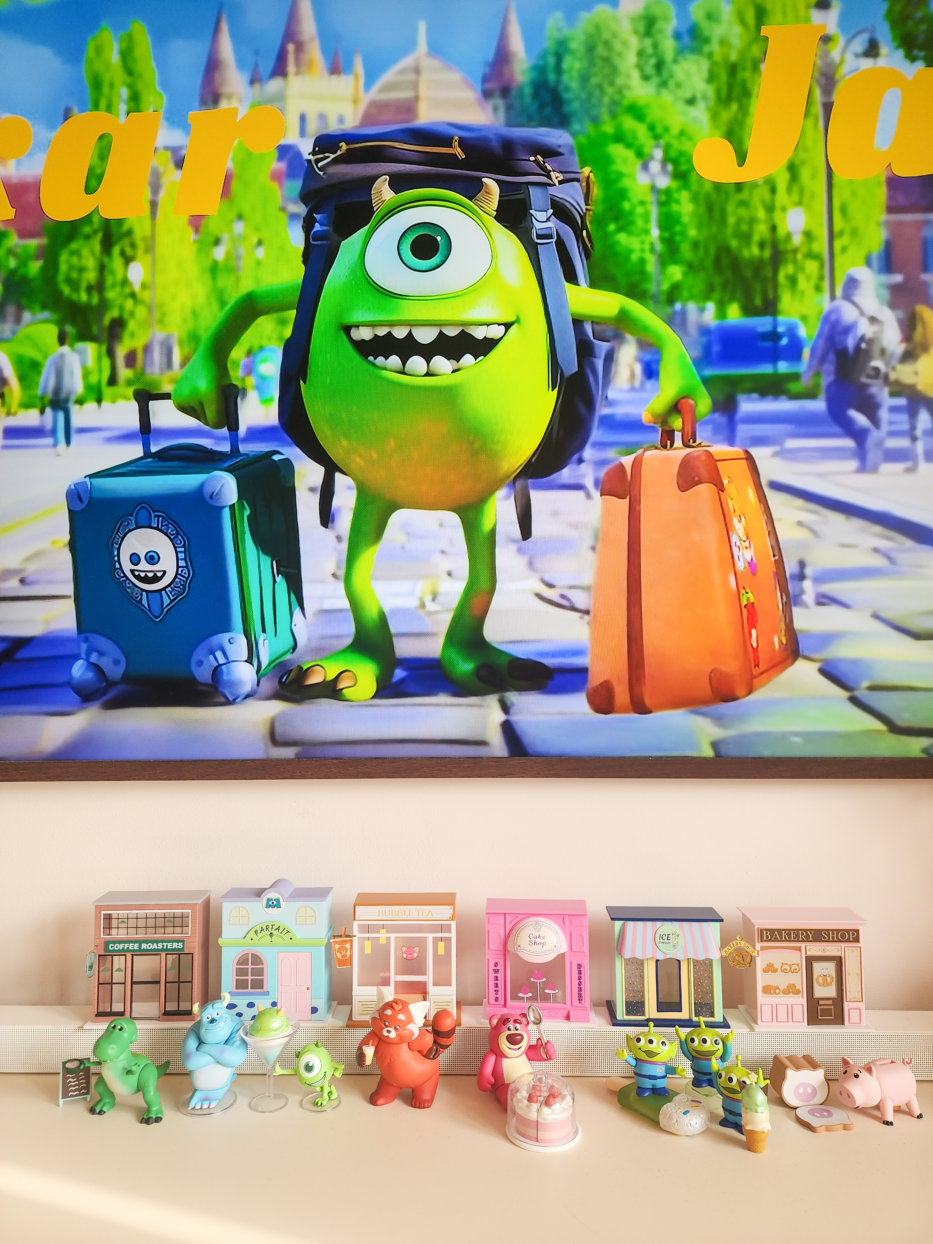 Our Cosy Living Room: ZERO CARPENTRY & Hints of Disney Magic! - Green alien character with large eyes and a backpack