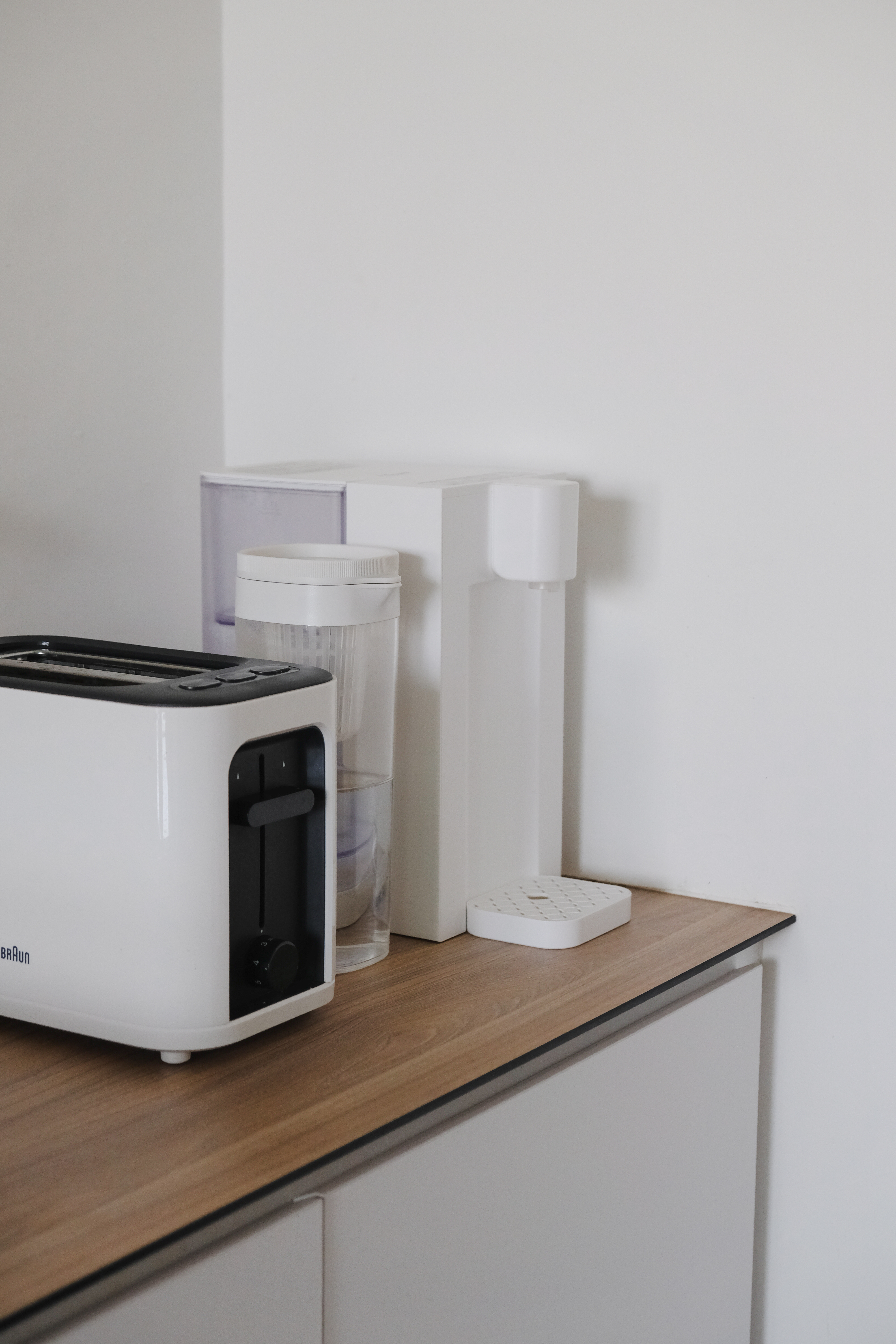 Clean and Functional: A Kitchen Designed with Smart Storage Solutions - Toaster, toaster oven, kitchen counter, modern