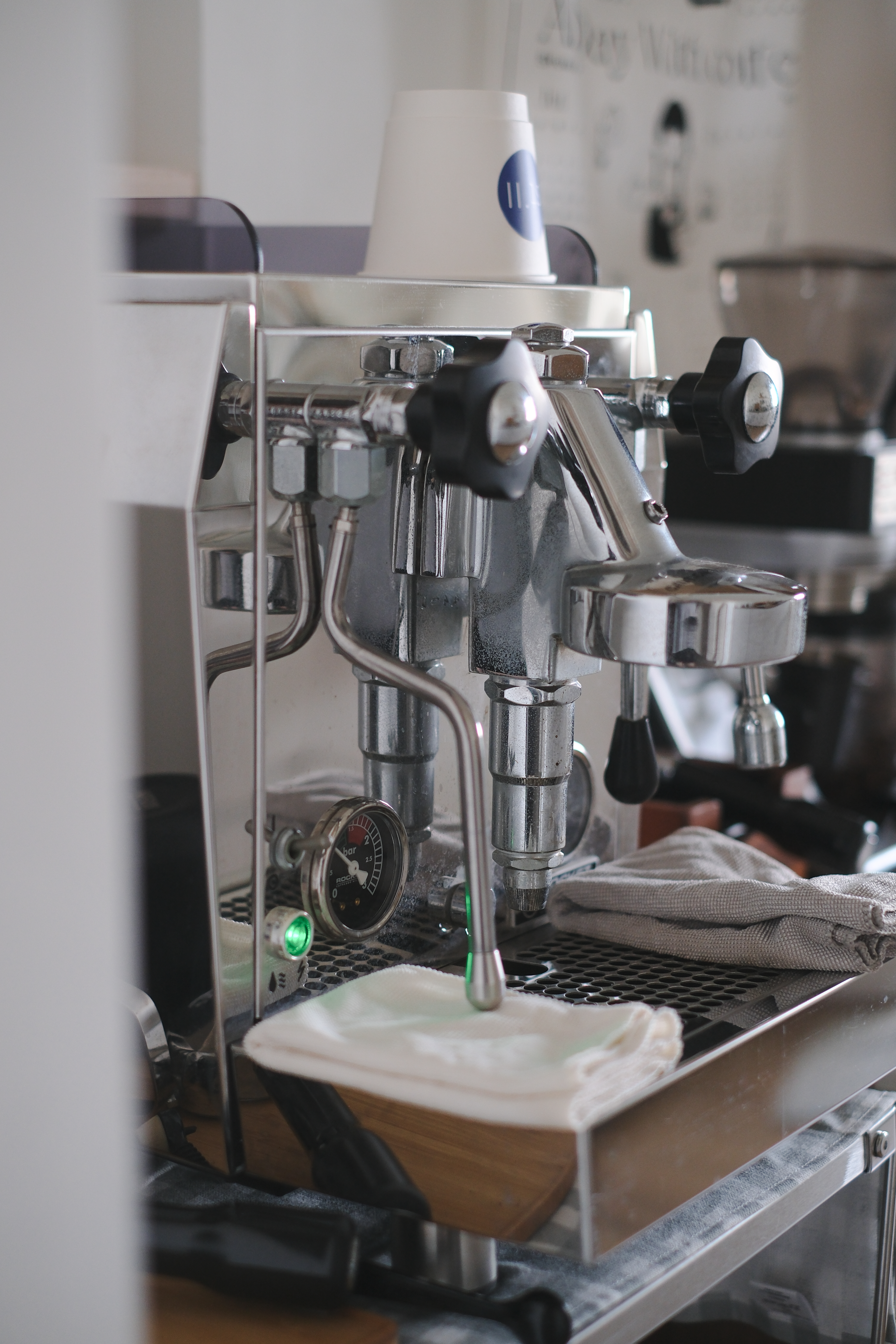 Clean and Functional: A Kitchen Designed with Smart Storage Solutions - stainless steel espresso machine, coffee beans