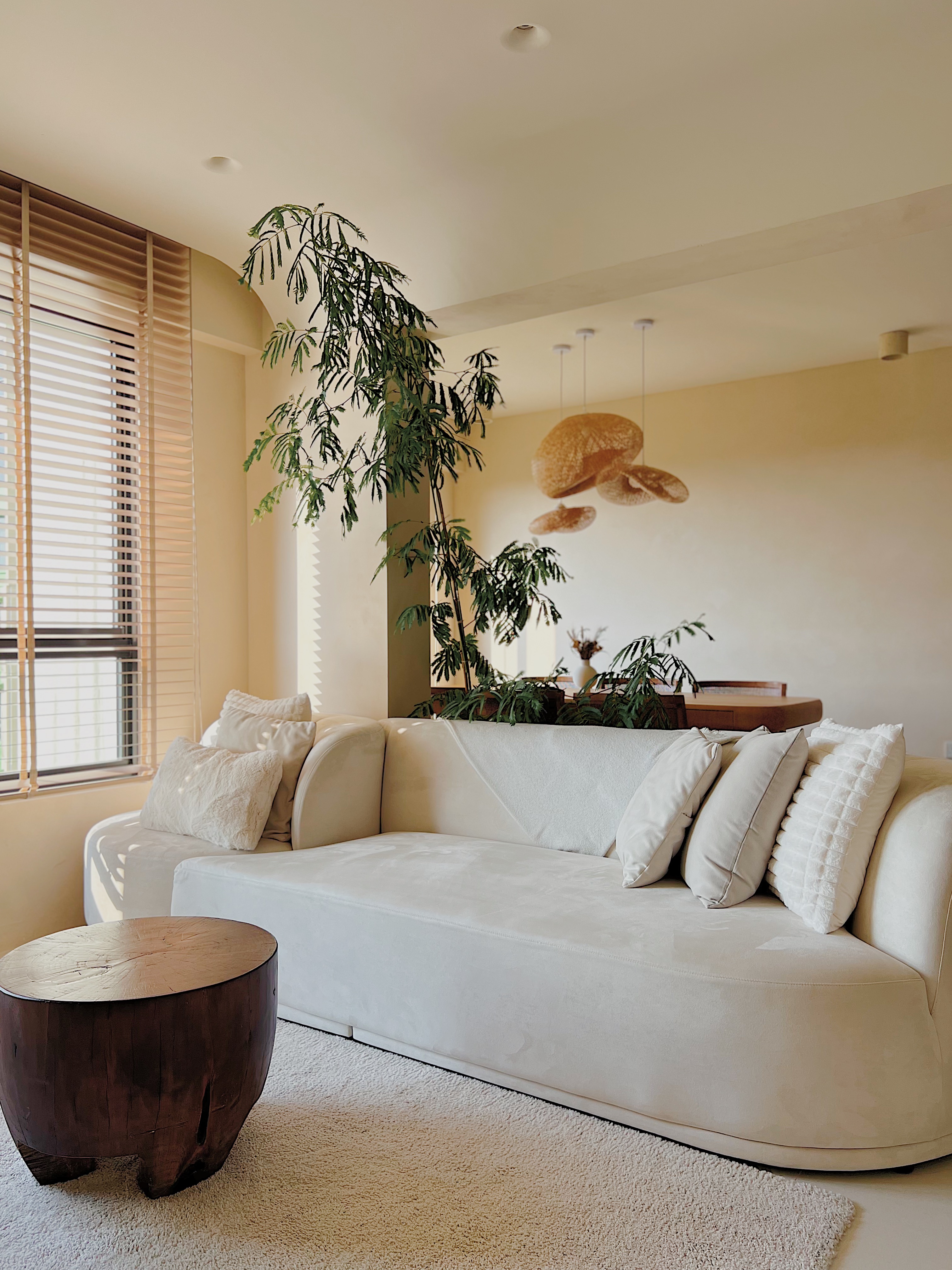 Favourite Cozy Corners of our Home  - Cream-colored sofa, beige cushions, wooden coffee table, large window with blinds