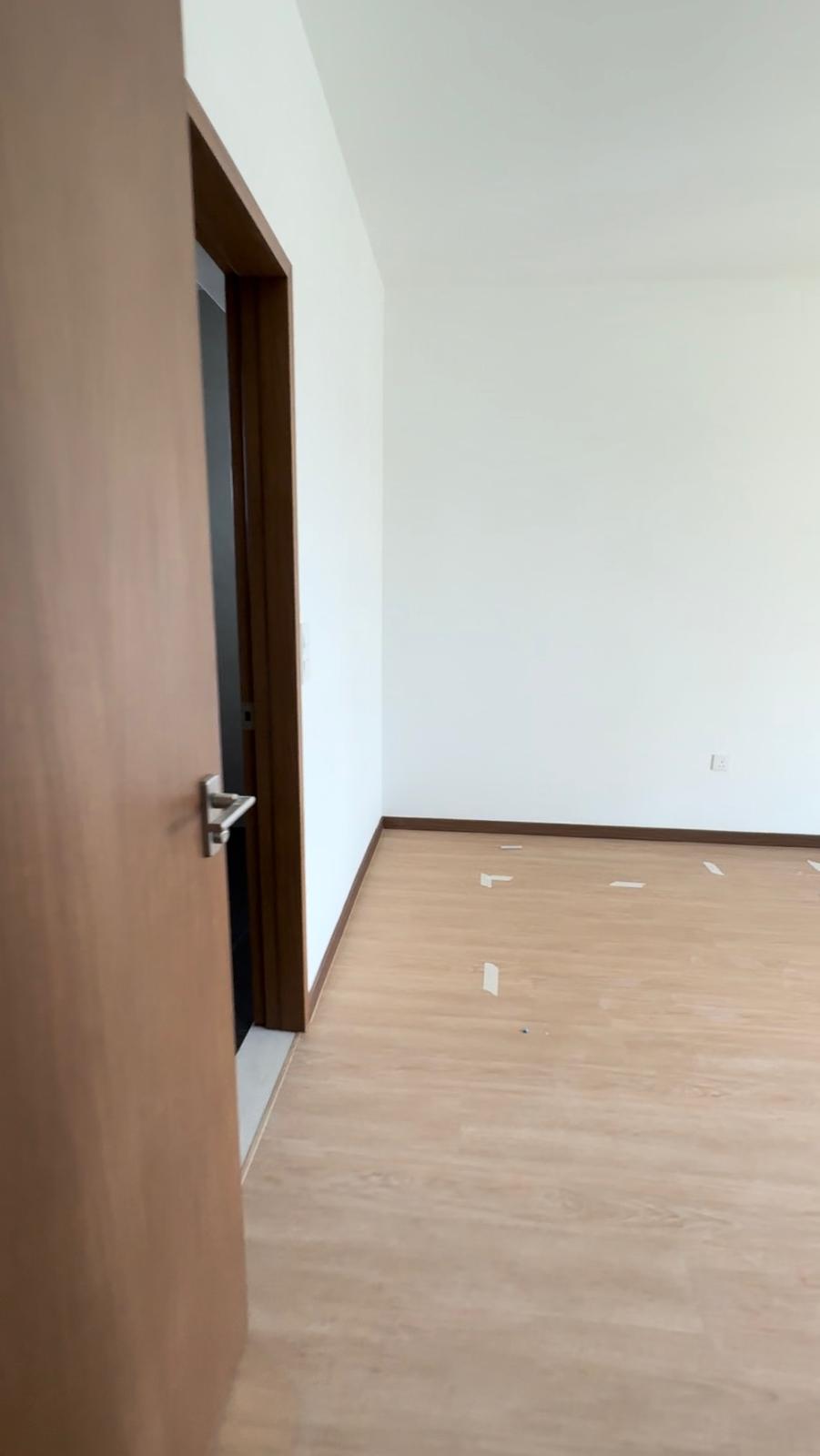 Before & After: Japandi Luxe Master bed & bath - Wooden door, white walls, light wooden floor, empty room, minimalistic