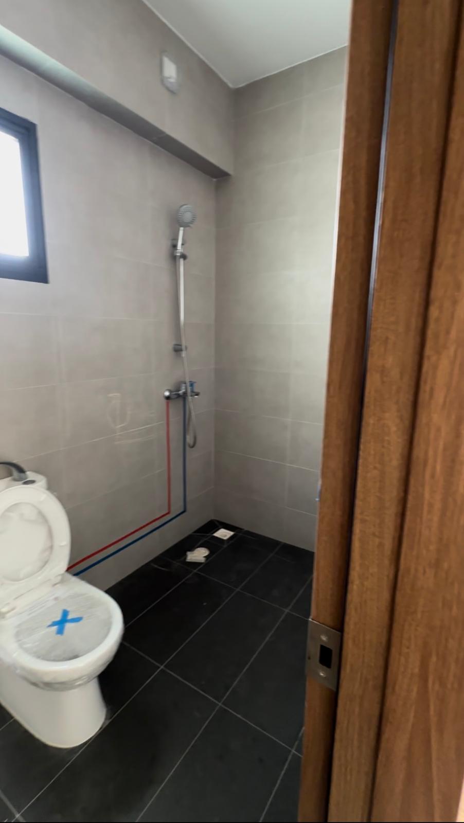 Before & After: Japandi Luxe Master bed & bath - Modern bathroom with white toilet, gray tiled walls, black floor tiles