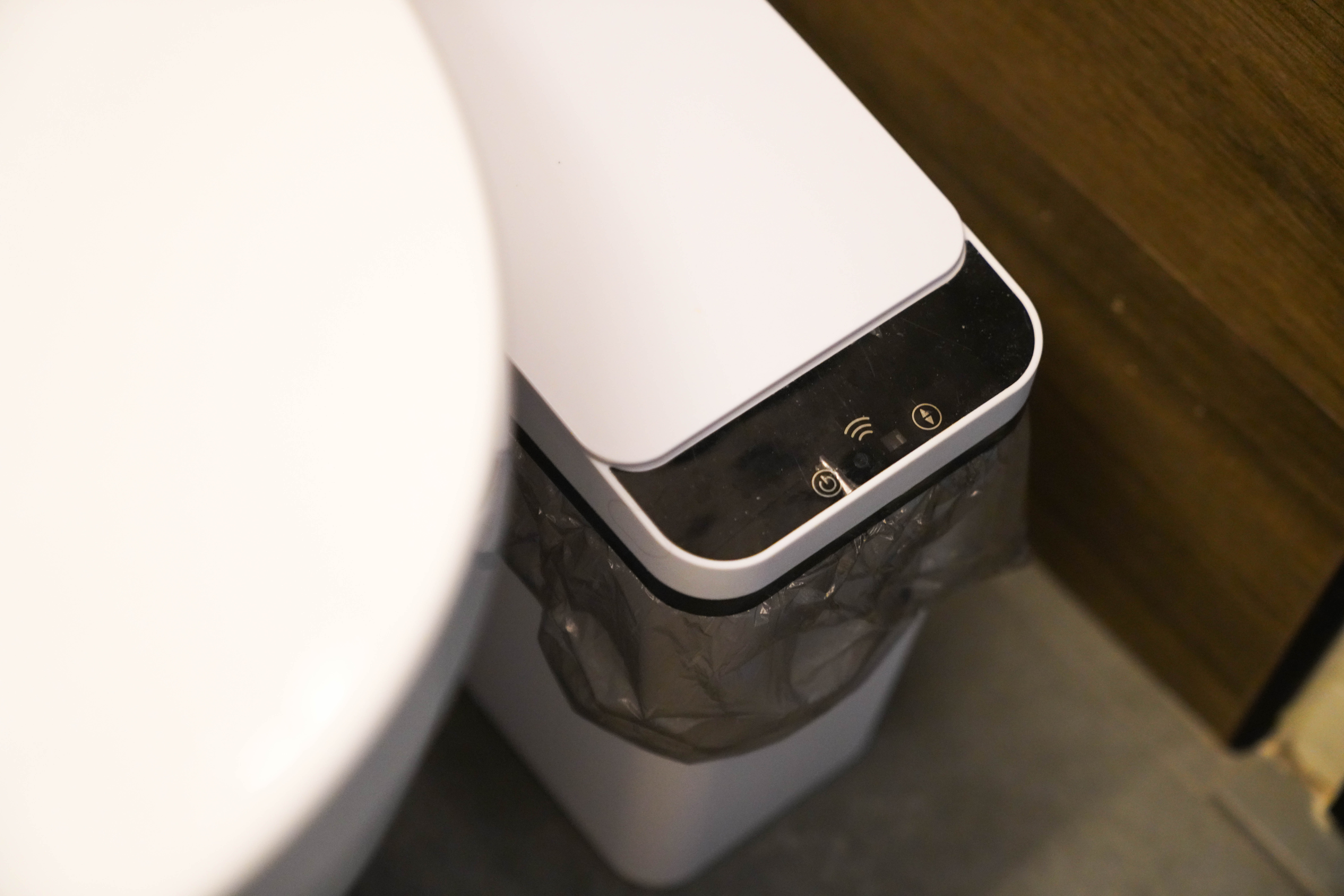 Resort-like Common Bathroom (+Smart Toilet @ $450) - White toilet with sleek design, black control panel, wireless