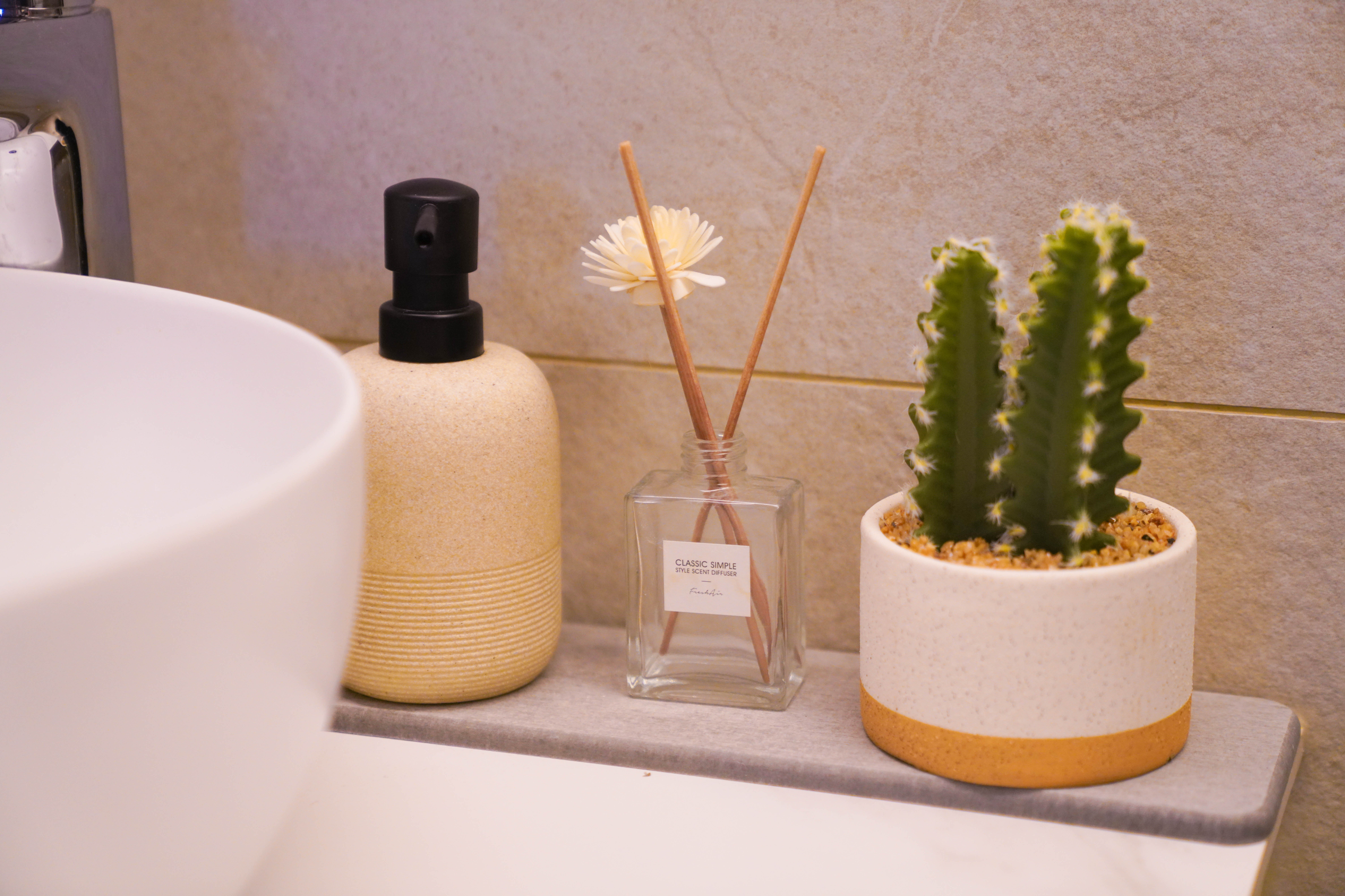 Resort-like Common Bathroom (+Smart Toilet @ $450) - Clear glass bottle, beige textured bottle, black pump dispenser, white