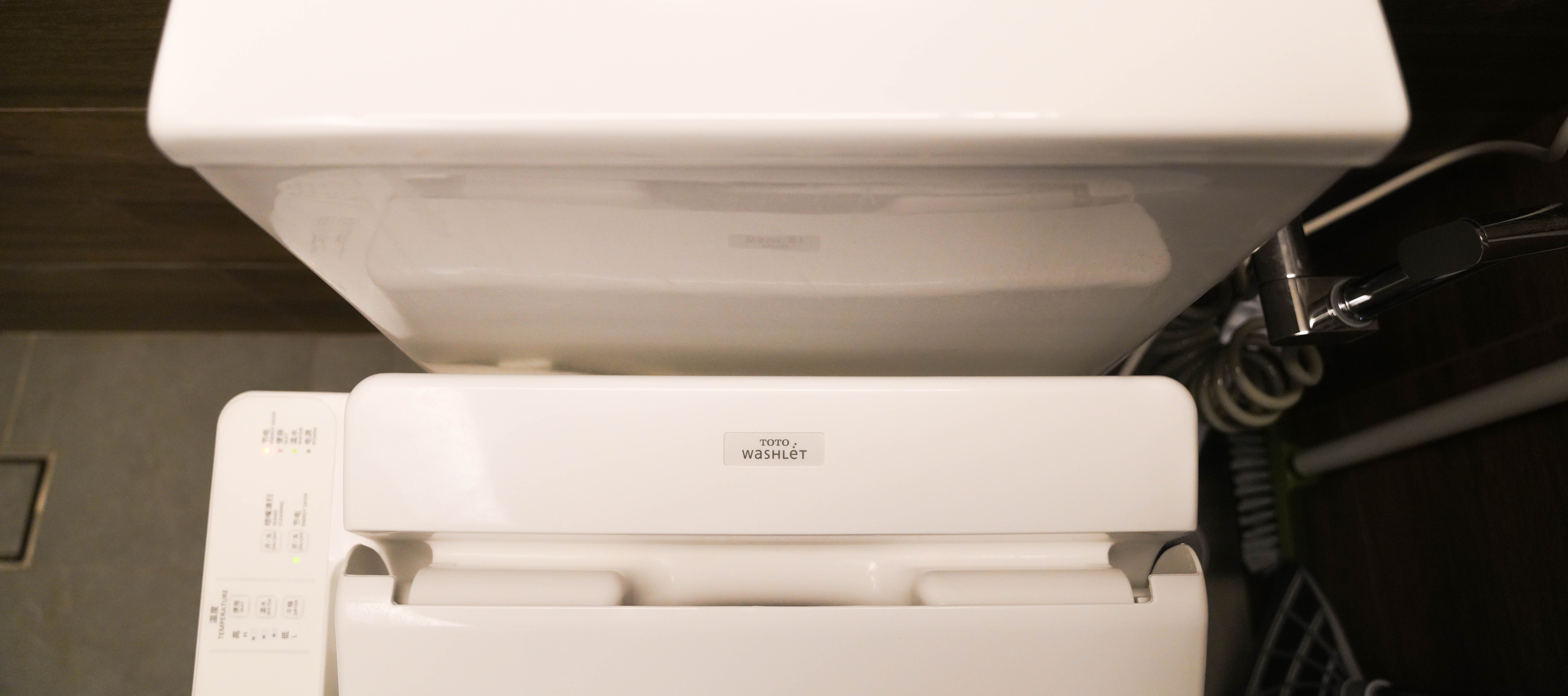 Resort-like Common Bathroom (+Smart Toilet @ $450) - White toilet with control panel, Japanese text on panel, modern design