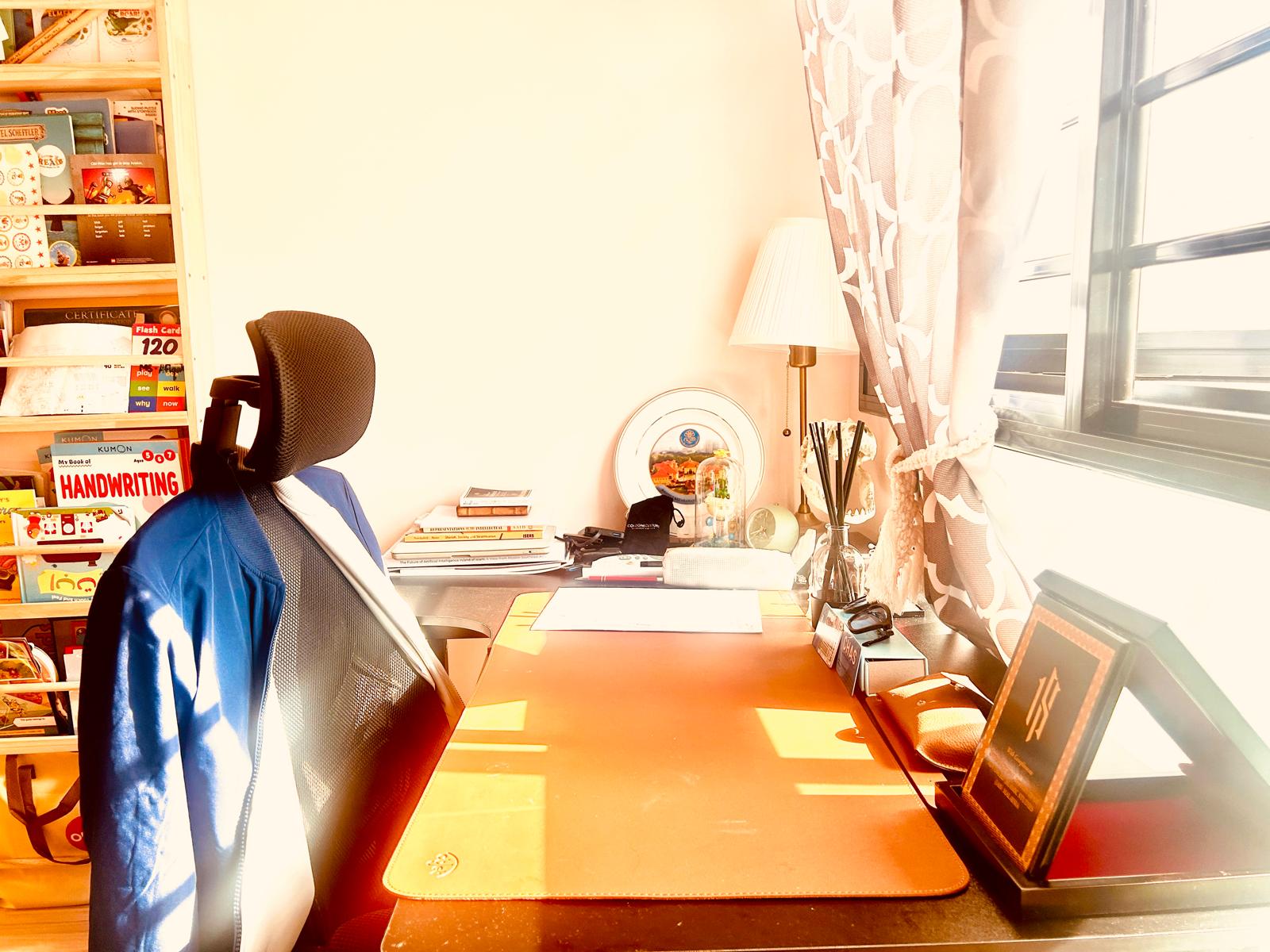 Airy and Inviting: A $26K Bohemian Mediterranean 4-RM BTO - Sunlight streaming through window, desk lamp casting shadows